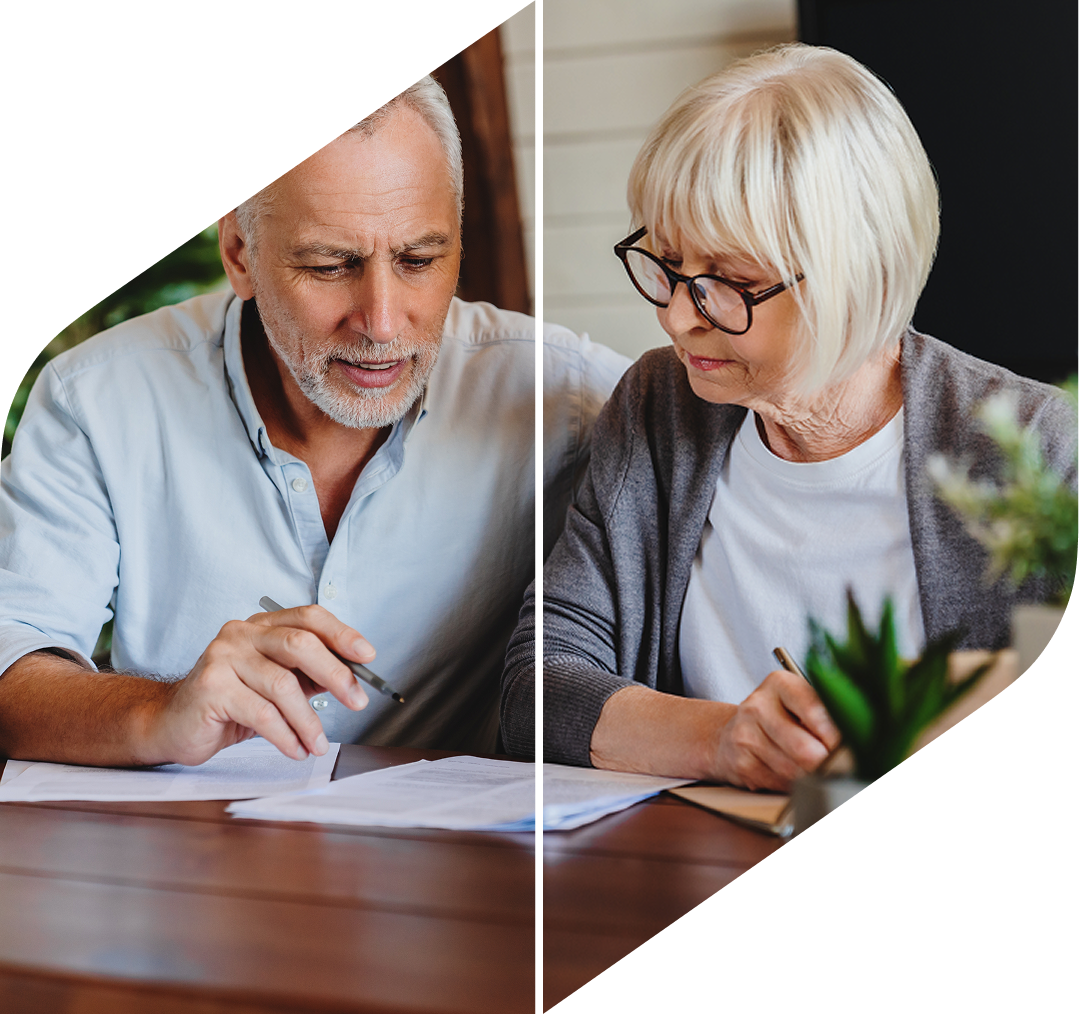 Older couple reviewing financial documents together as part of personalized financial planning.