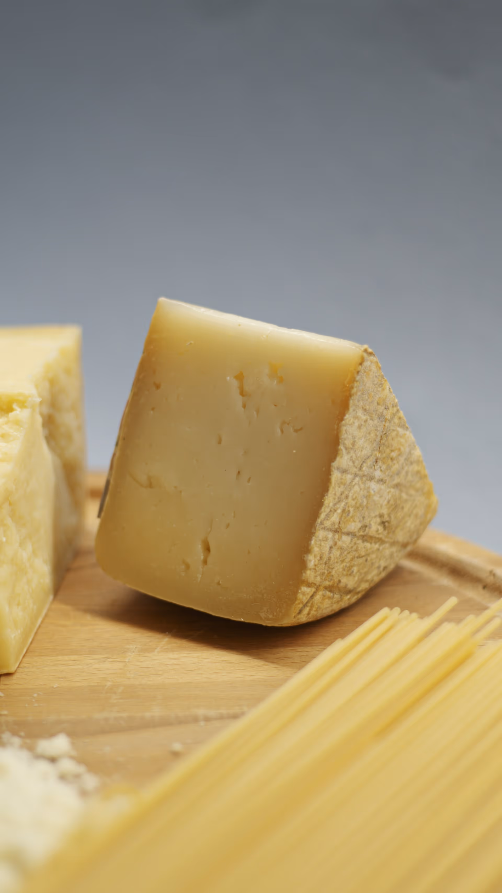 Aged hard cheese wheel selected for premium dairy service