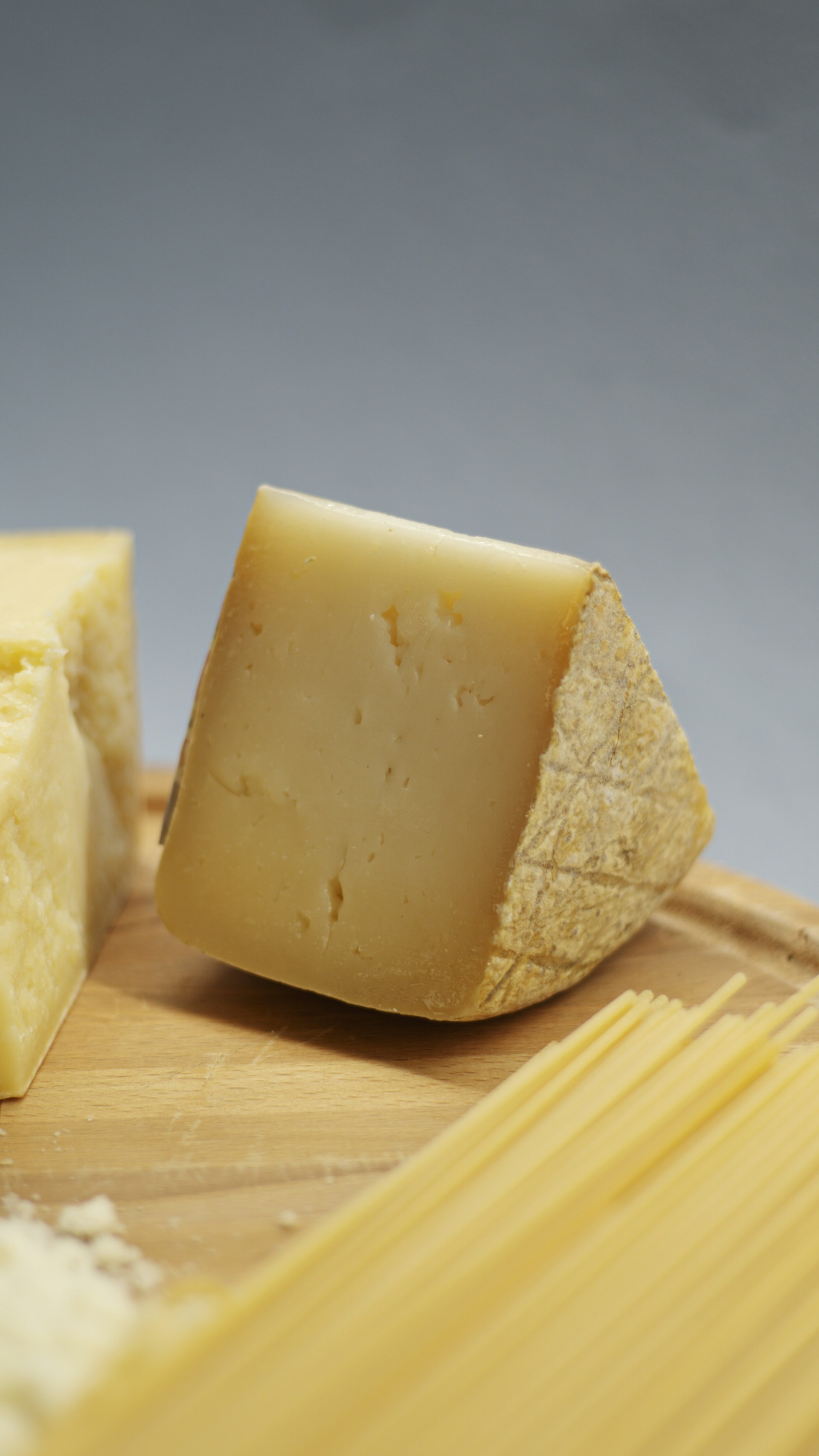 Aged hard cheese wheel selected for premium dairy service