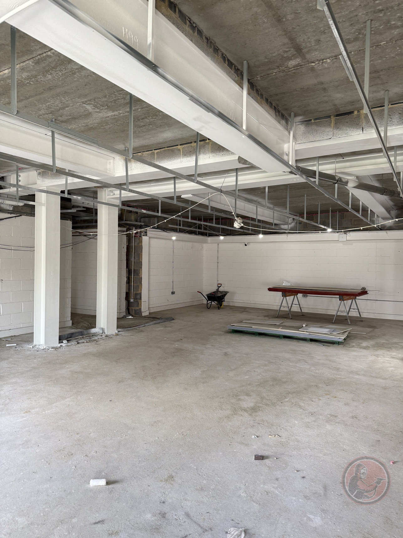 Completed white-coated structural steel inside Tilbury Community Centre.