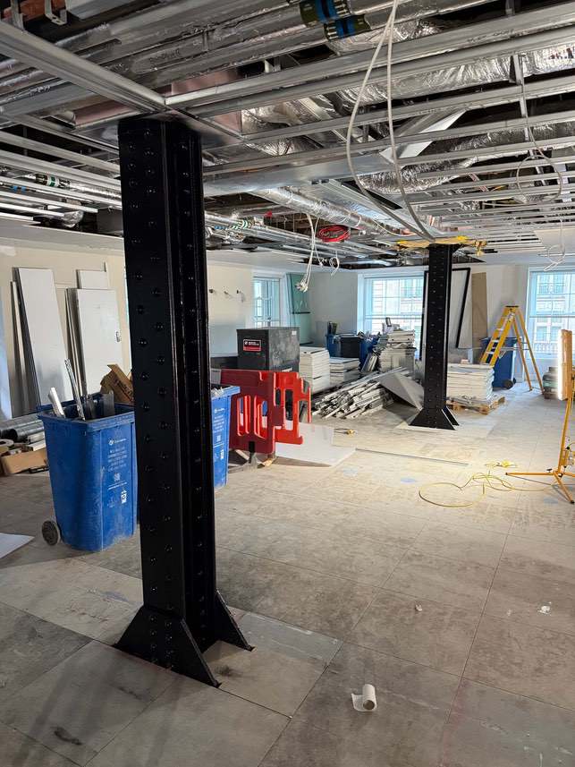 Completed black-finished steel column inside the Devonshire House refurbishment.