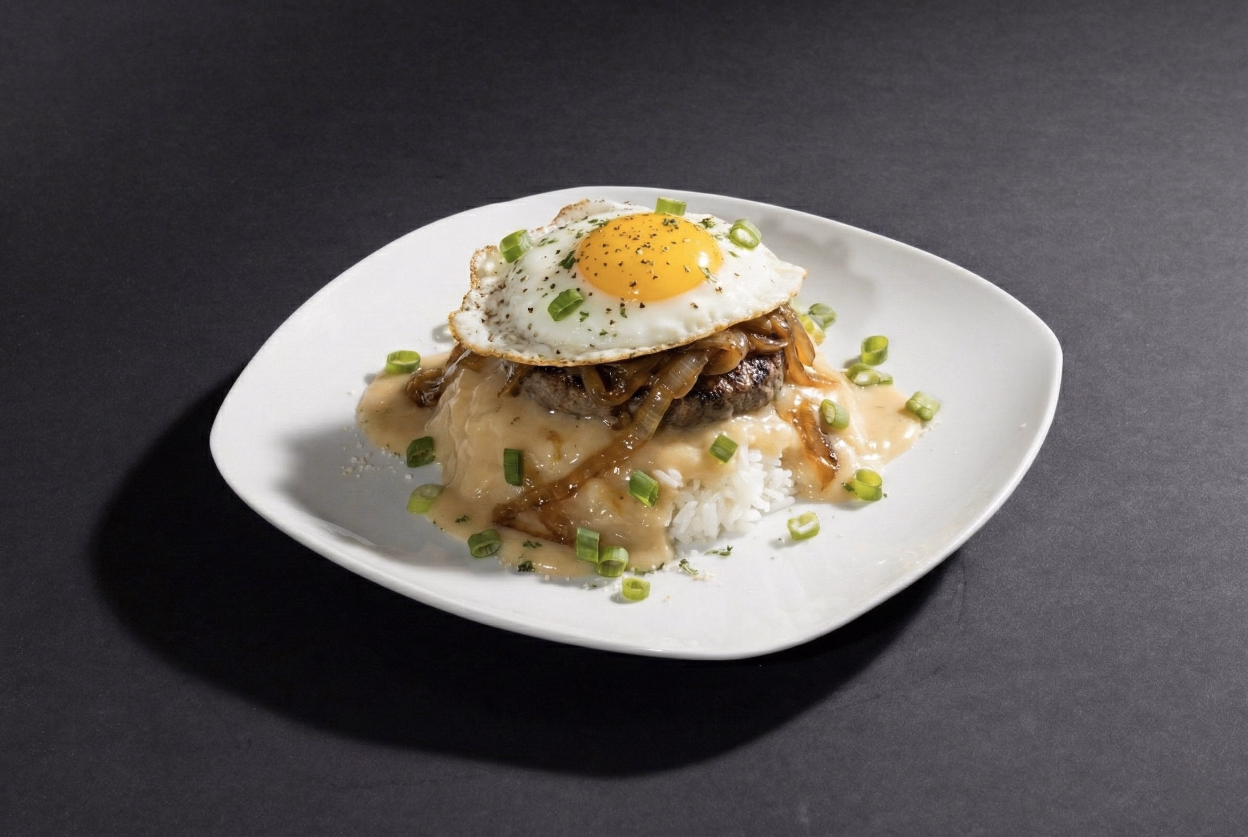 Neon sign with the words 'COMING SOON' in pink and blue lights on a dark brick wall background.