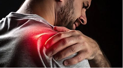 Man holding a painful shoulder