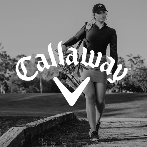 Woman carrying golf clubs walking on a path with Callaway logo overlay.