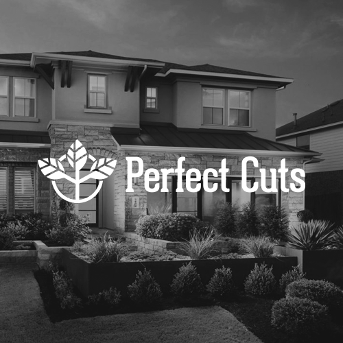 Residential modern two-story house with landscaped front yard and Perfect Cuts logo featuring a stylized leaf design.