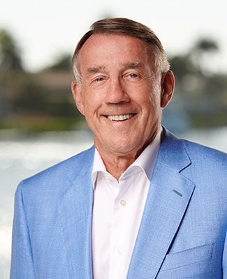 portrait of Larry Leinweber smiling wearing a light blue shirt