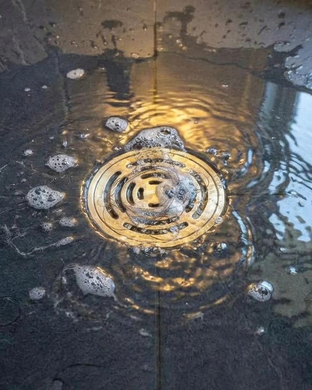 Bespoke Plumbing technician using a CCTV drain camera to inspect a blocked drain at a Balmain property