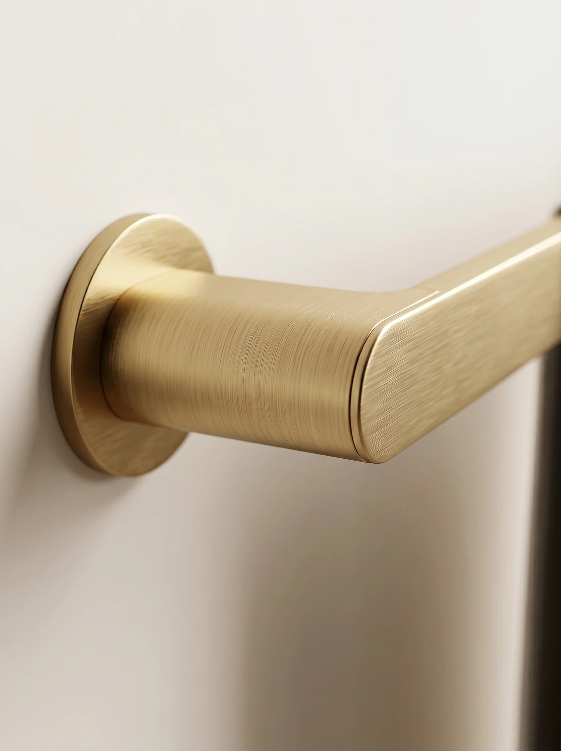 Aurum Towel Rail detail — close-up of the brushed brass mount