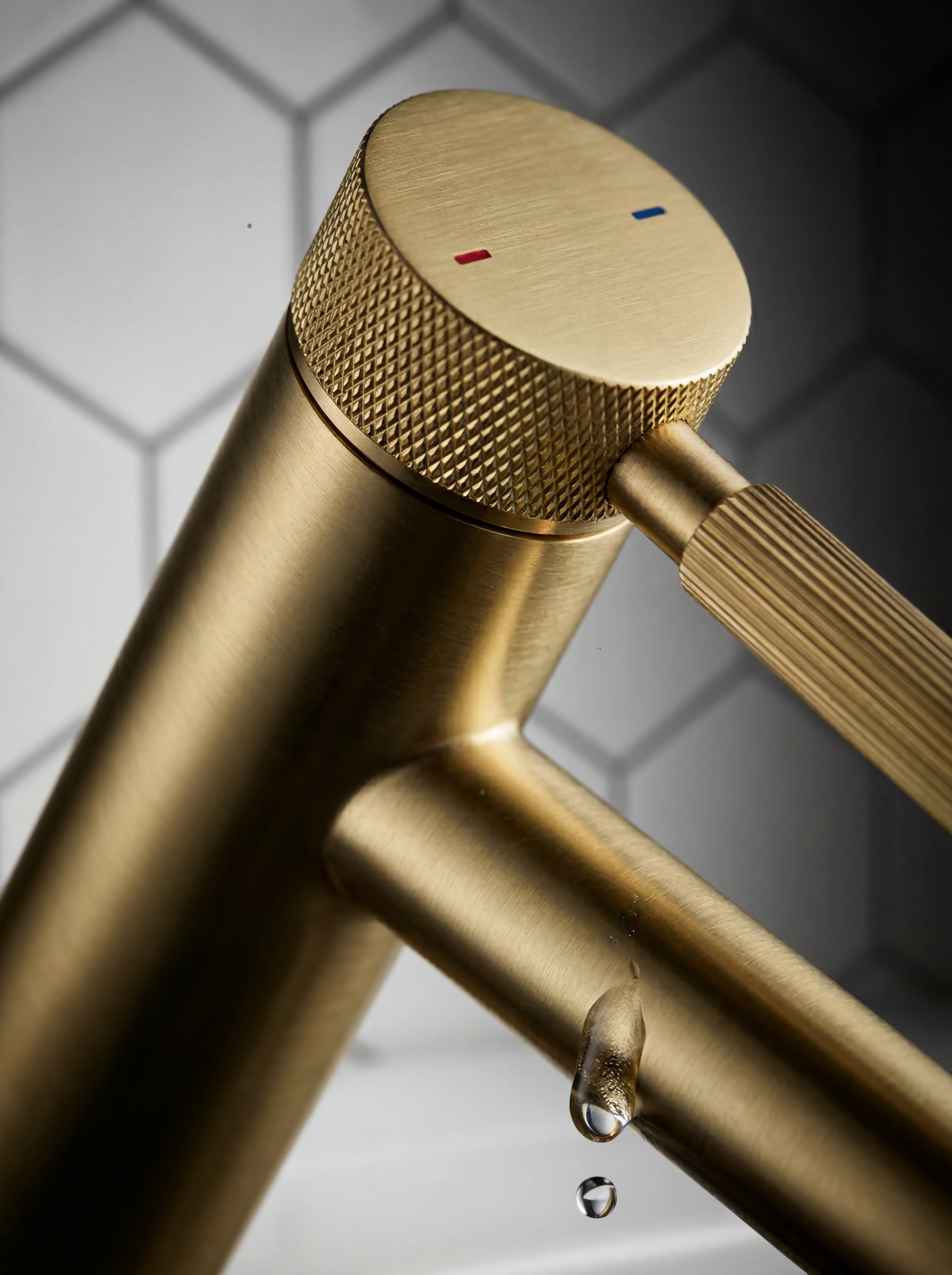 Vermeil basin tap detail — close-up of the brushed gold lever