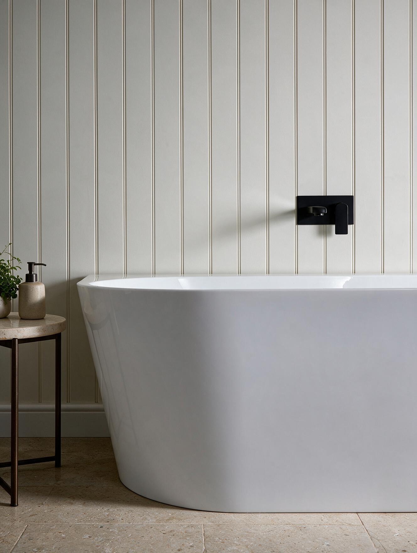 Anse bath styled with a matte black wall-mounted tap