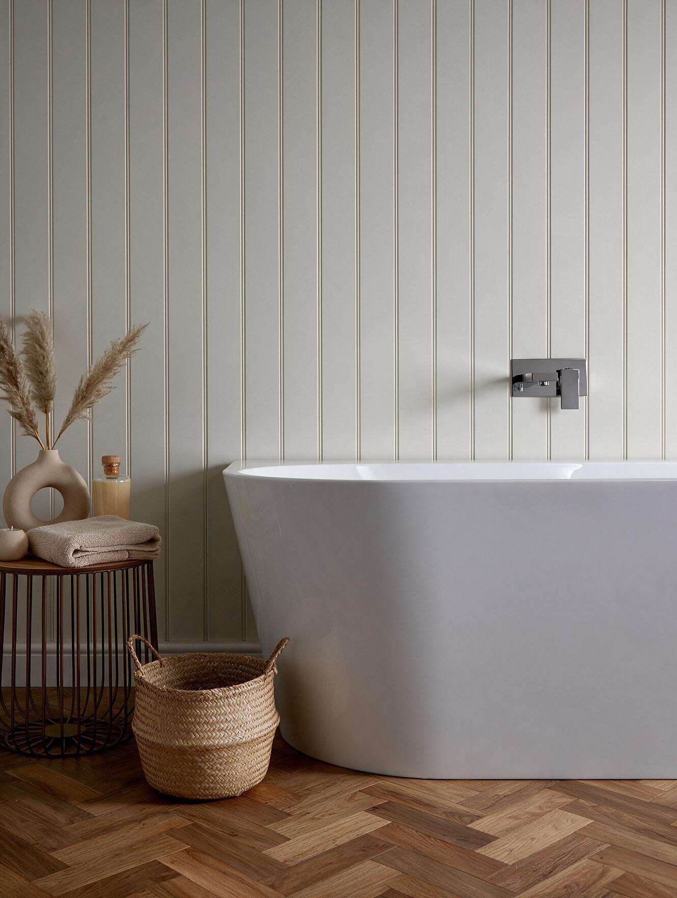 Anse bath in a considered bathroom with herringbone flooring