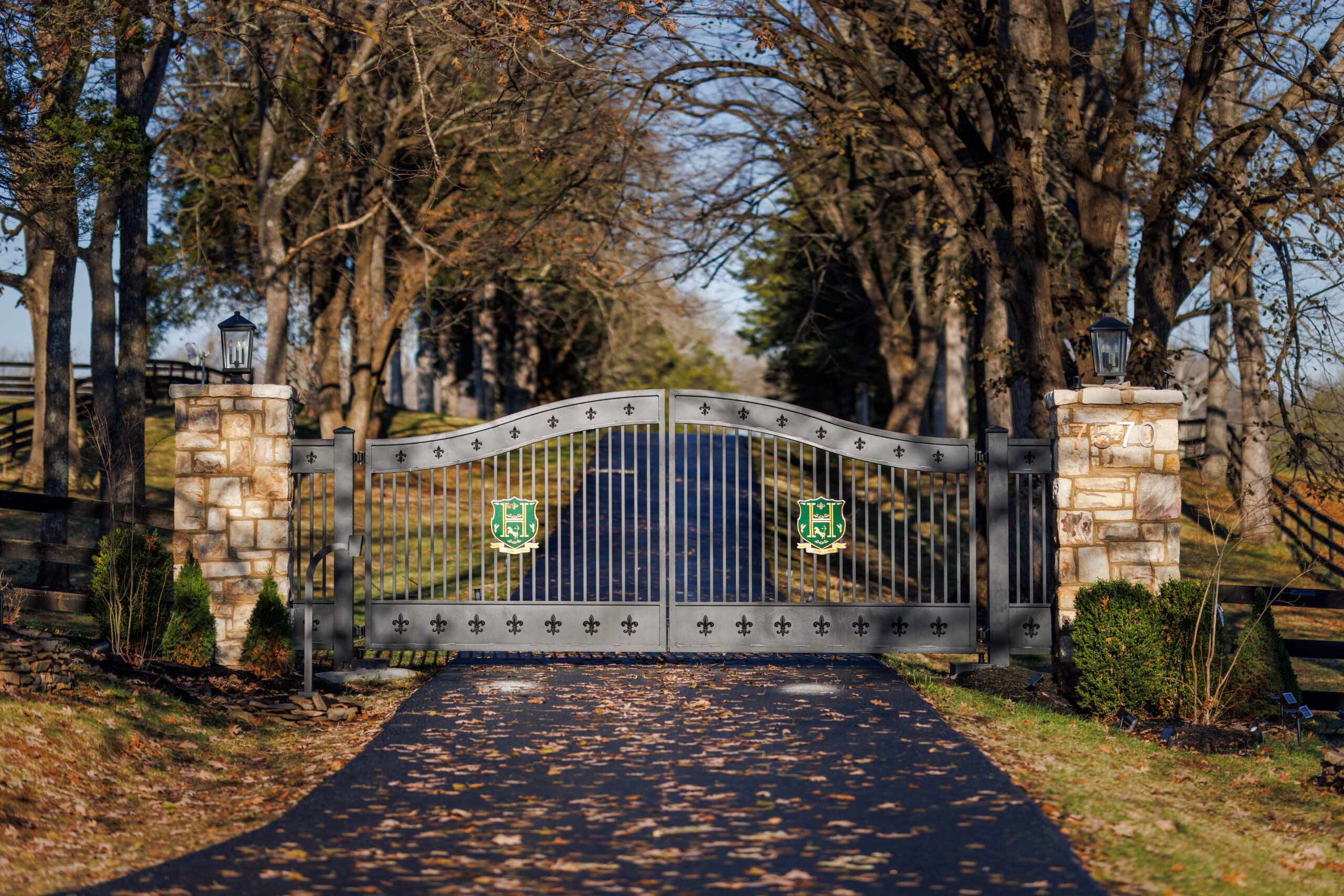 Private estate entrance driveway symbolising controlled access and balance