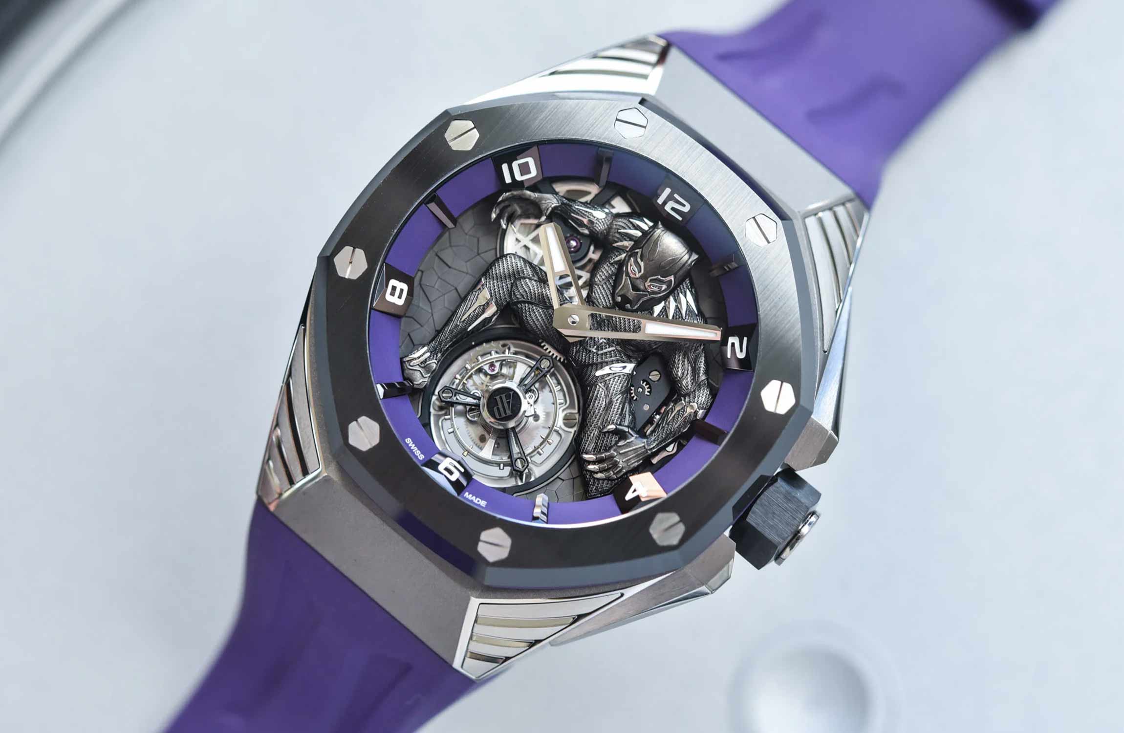 Audemars Piguet luxury watches including the Black Panther Royal Oak and historic Grosse Pièce displayed on a cinematic black background.