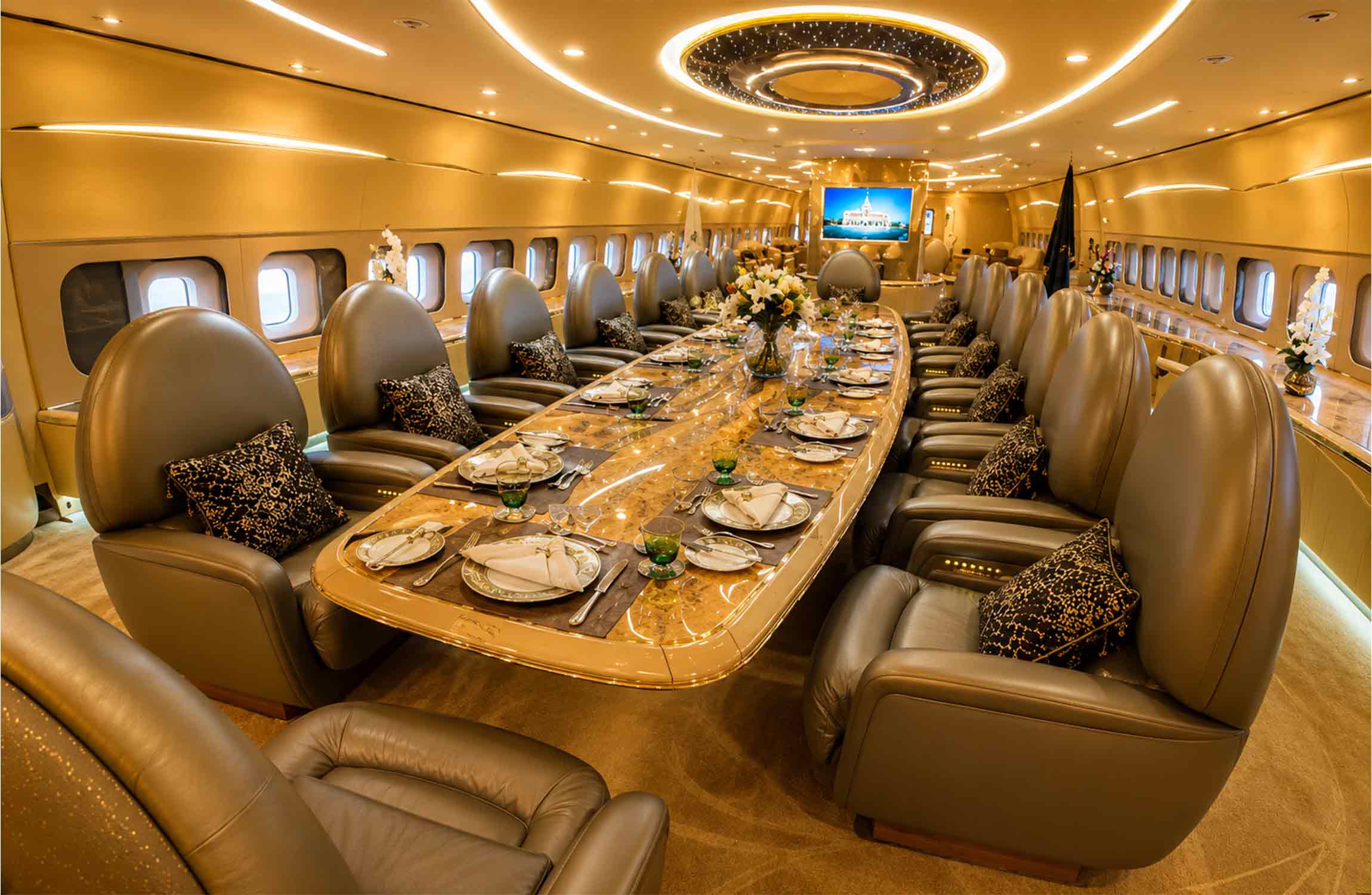 Ultra-luxurious dining room aboard the Airbus A380 Flying Palace featuring a long executive table, premium leather seats, and bespoke private jet interior design.