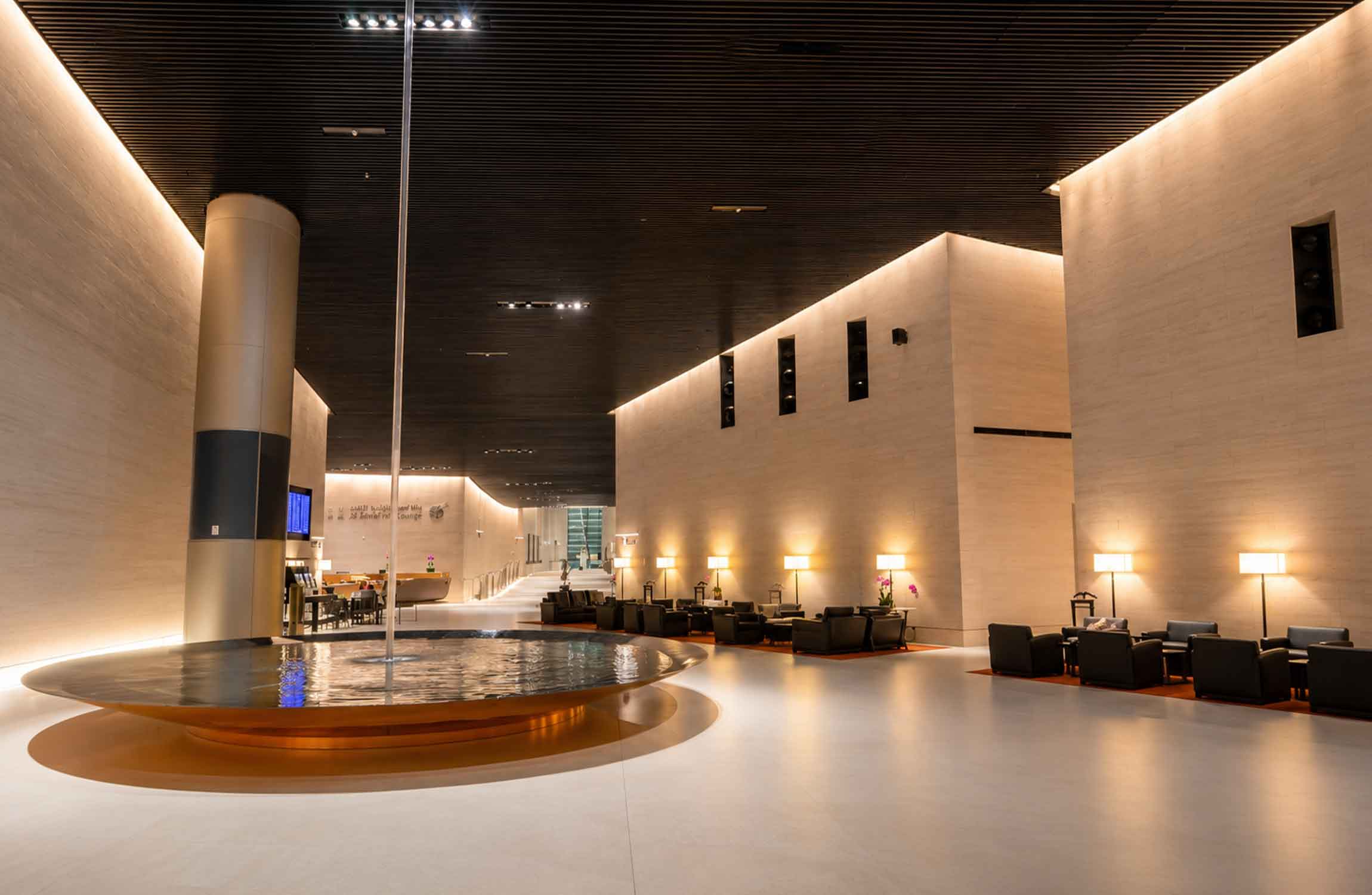 Interior of Qatar Airways Al Safwa First Lounge at Hamad International Airport in Doha, featuring minimalist architecture, luxurious seating and elegant contemporary design