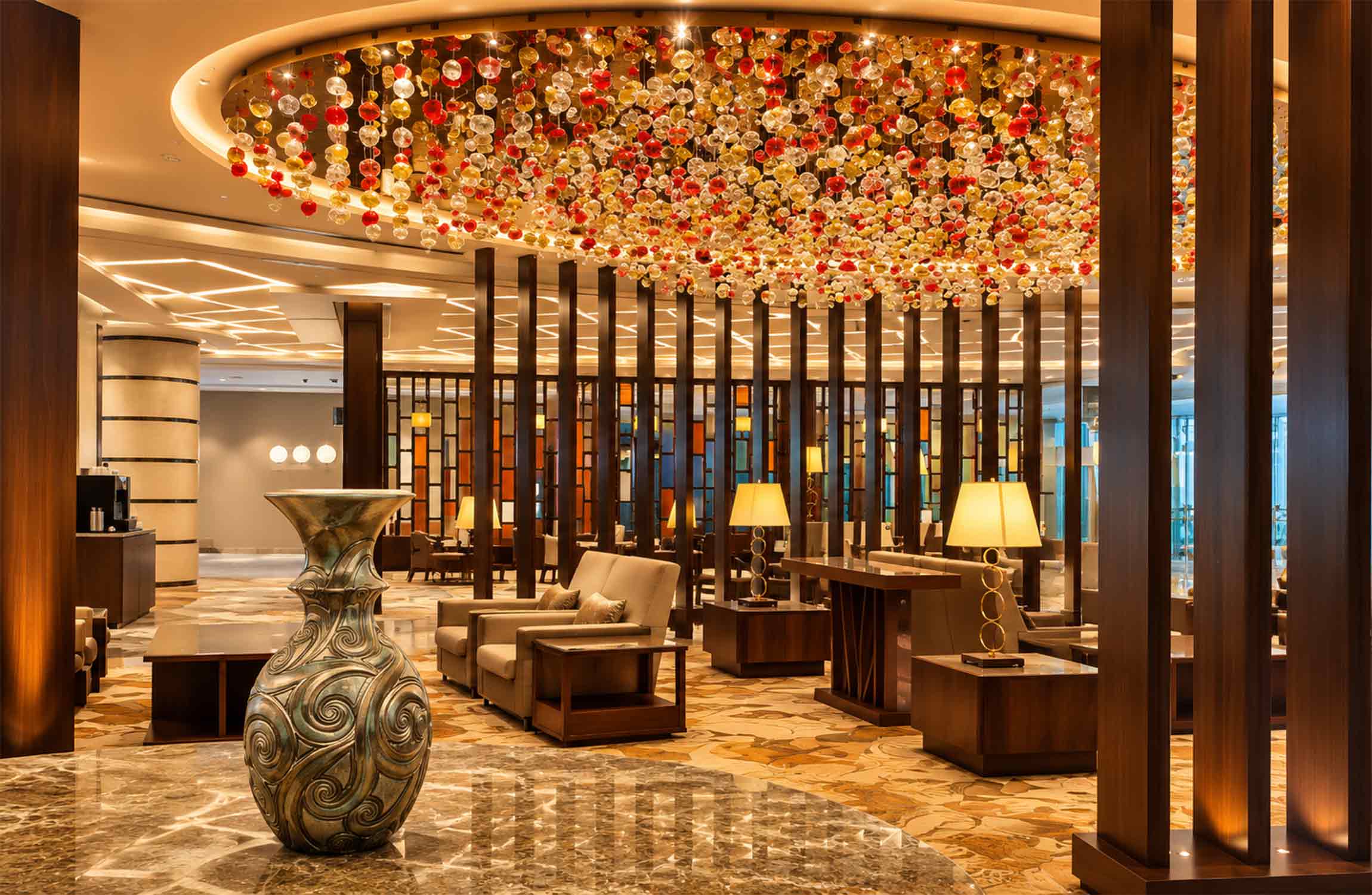 Interior of the Emirates First Class Lounge at Dubai International Airport, showcasing luxurious contemporary design, elegant seating areas and premium first-class hospitality.