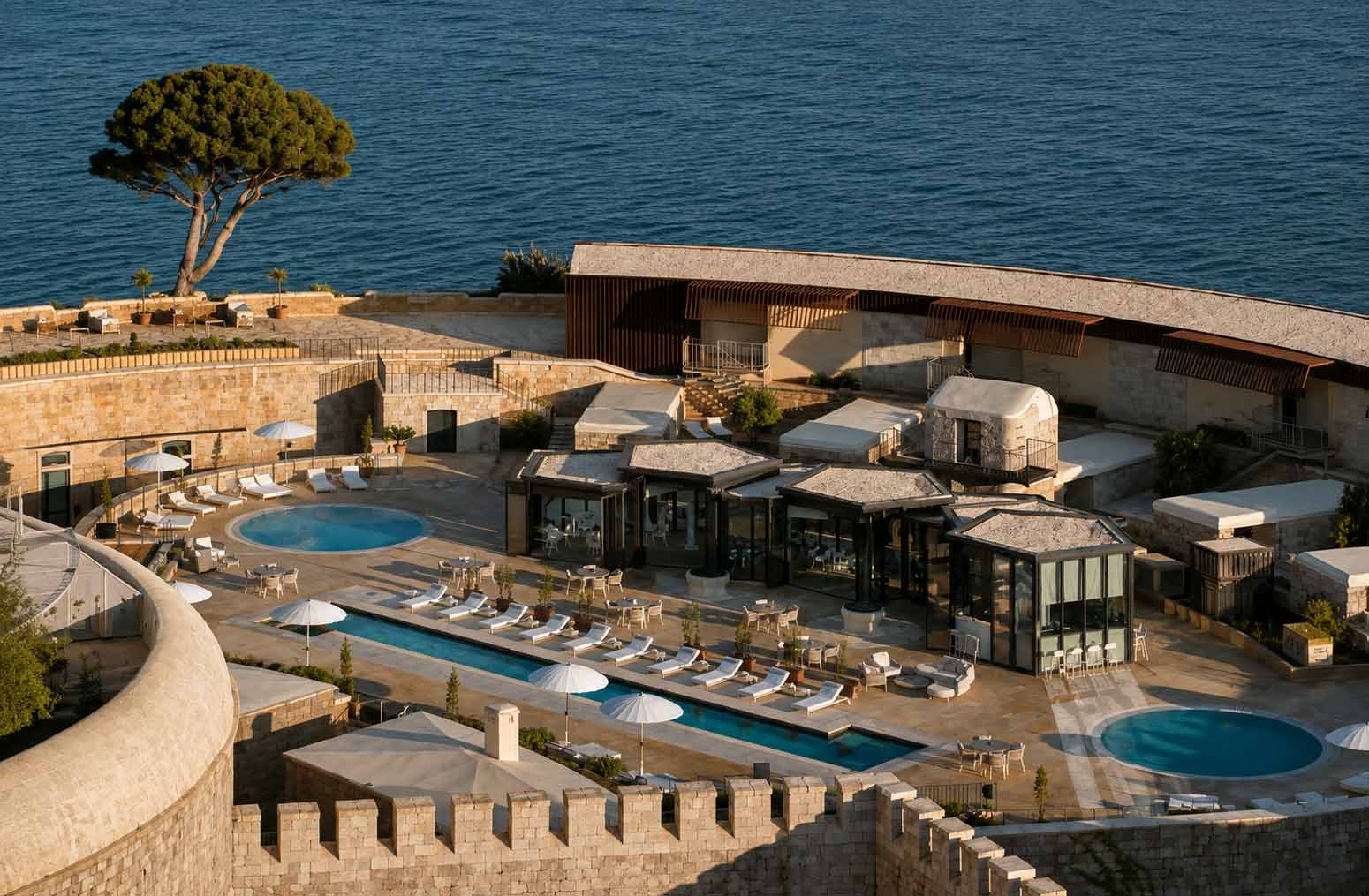 Mamula Island by Banyan Tree in Montenegro, featuring luxury swimming pools and contemporary spaces within the restored 19th-century fortress overlooking the Adriatic Sea.