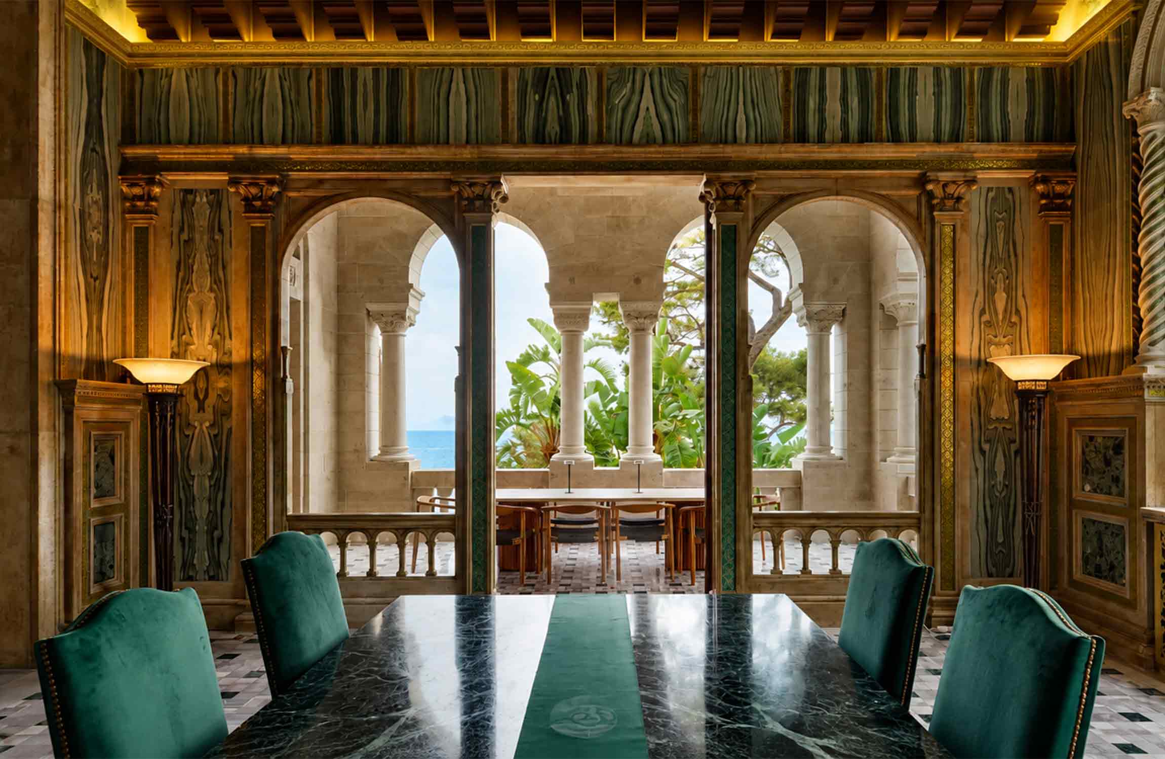 Luxury dining room inside Villa Cypris in Roquebrune-Cap-Martin, with ornate marble arches and Mediterranean Sea views near Monaco.