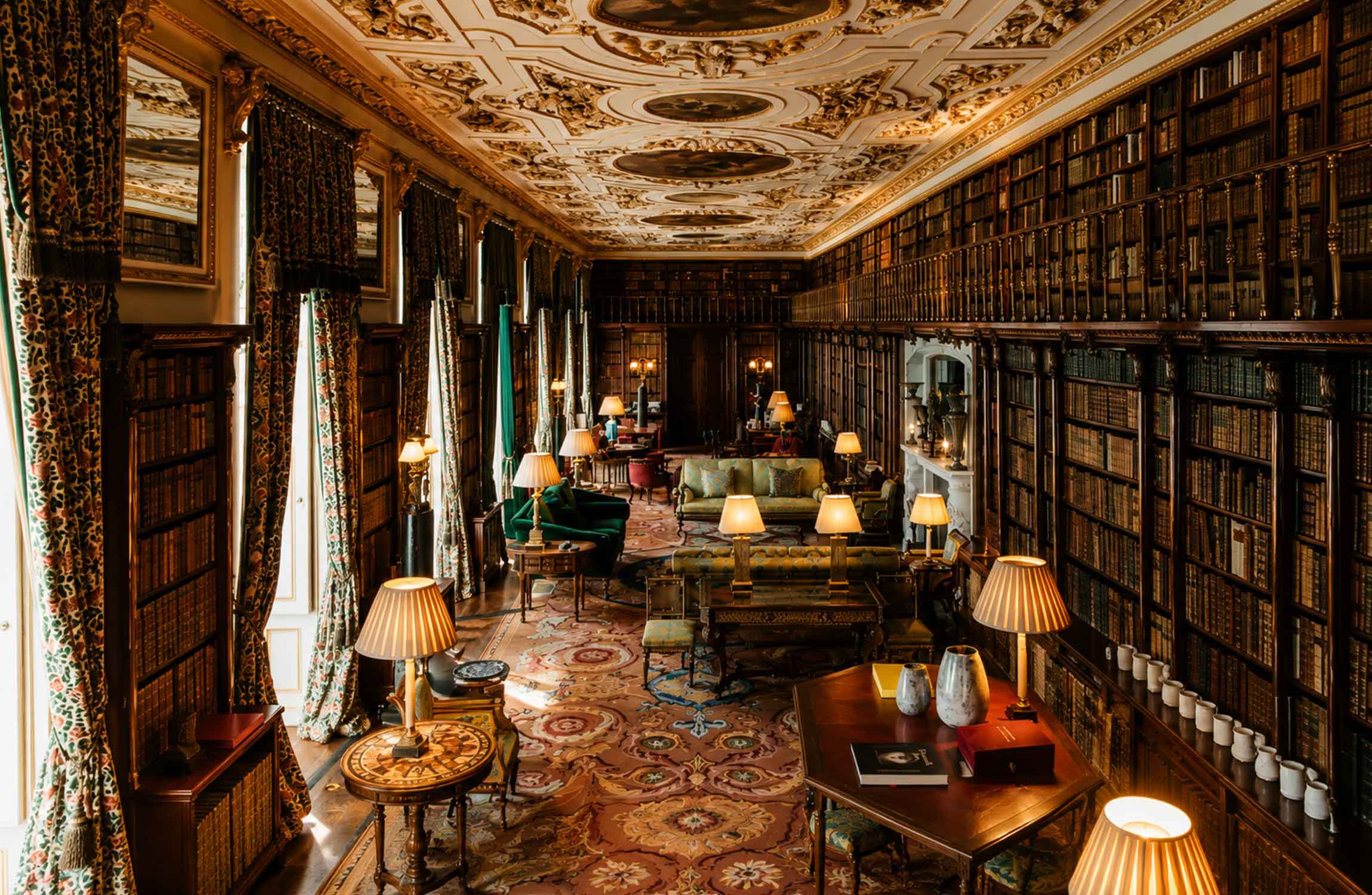 Luxury private library with floor-to-ceiling bookshelves, historic books and an ornate old-world interior
