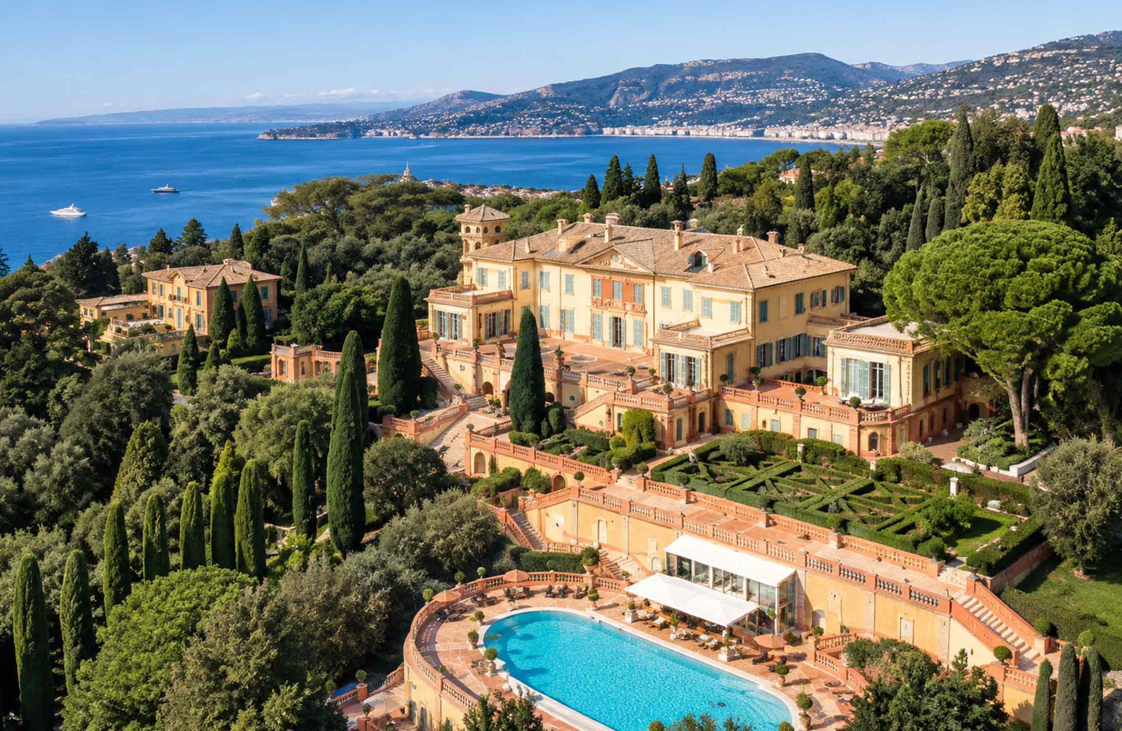Aerial view of Villa Leopolda in Villefranche-sur-Mer, surrounded by Mediterranean gardens on the French Riviera
