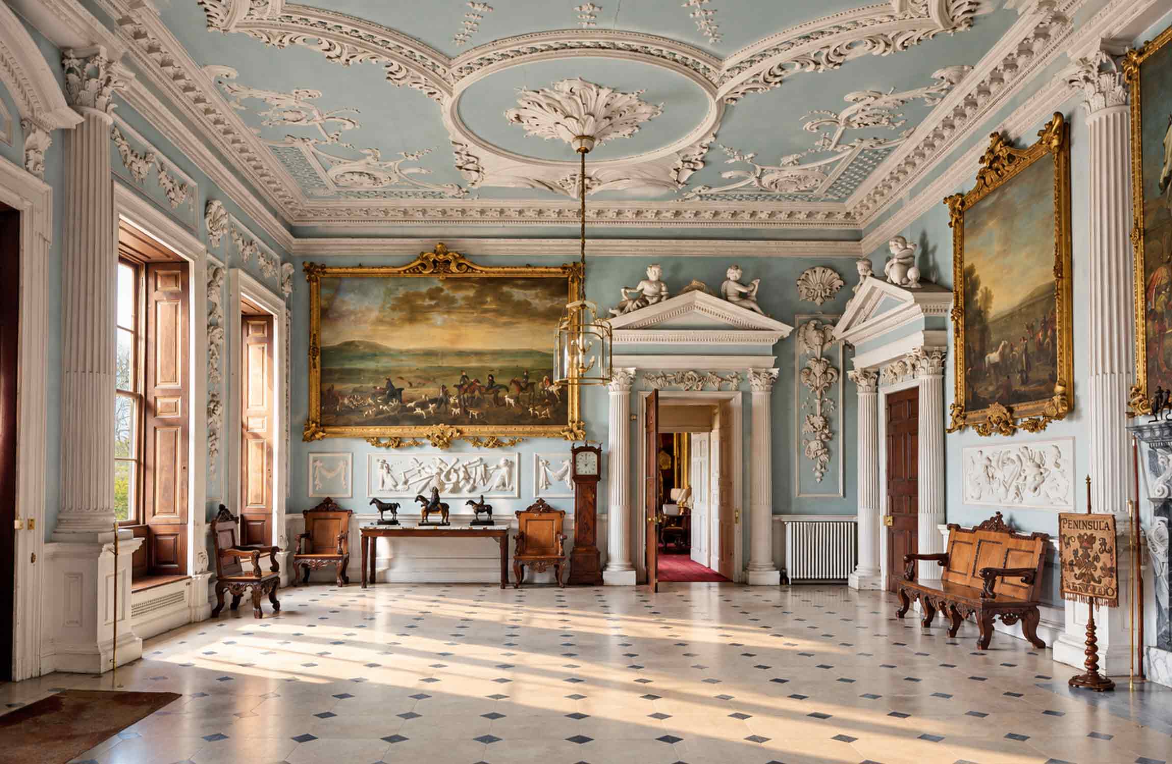 Historic interior of Badminton House in Gloucestershire, the estate used as Halstead Manor in Netflix's The Gentlemen.