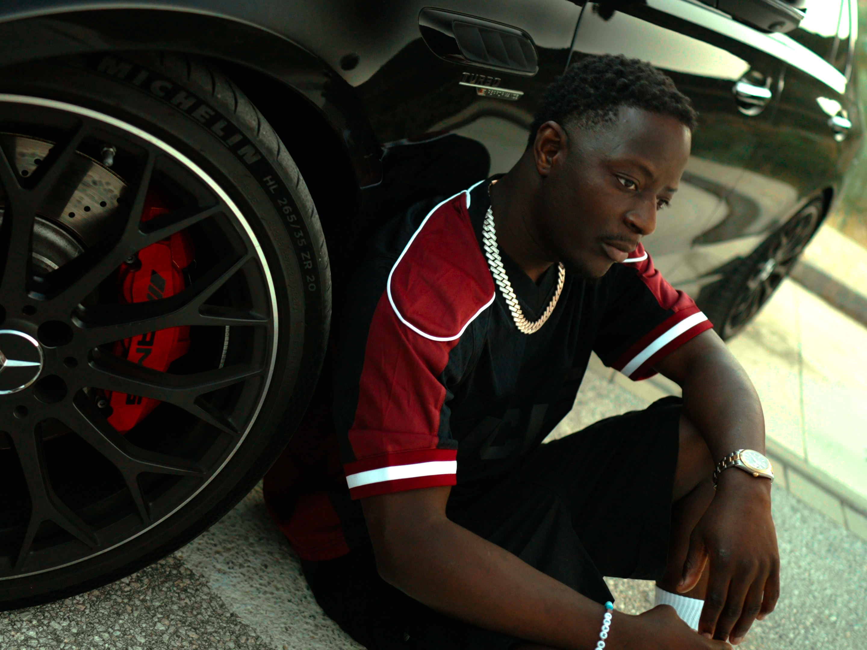 Beautiful young woman in orange glasses on orange background.