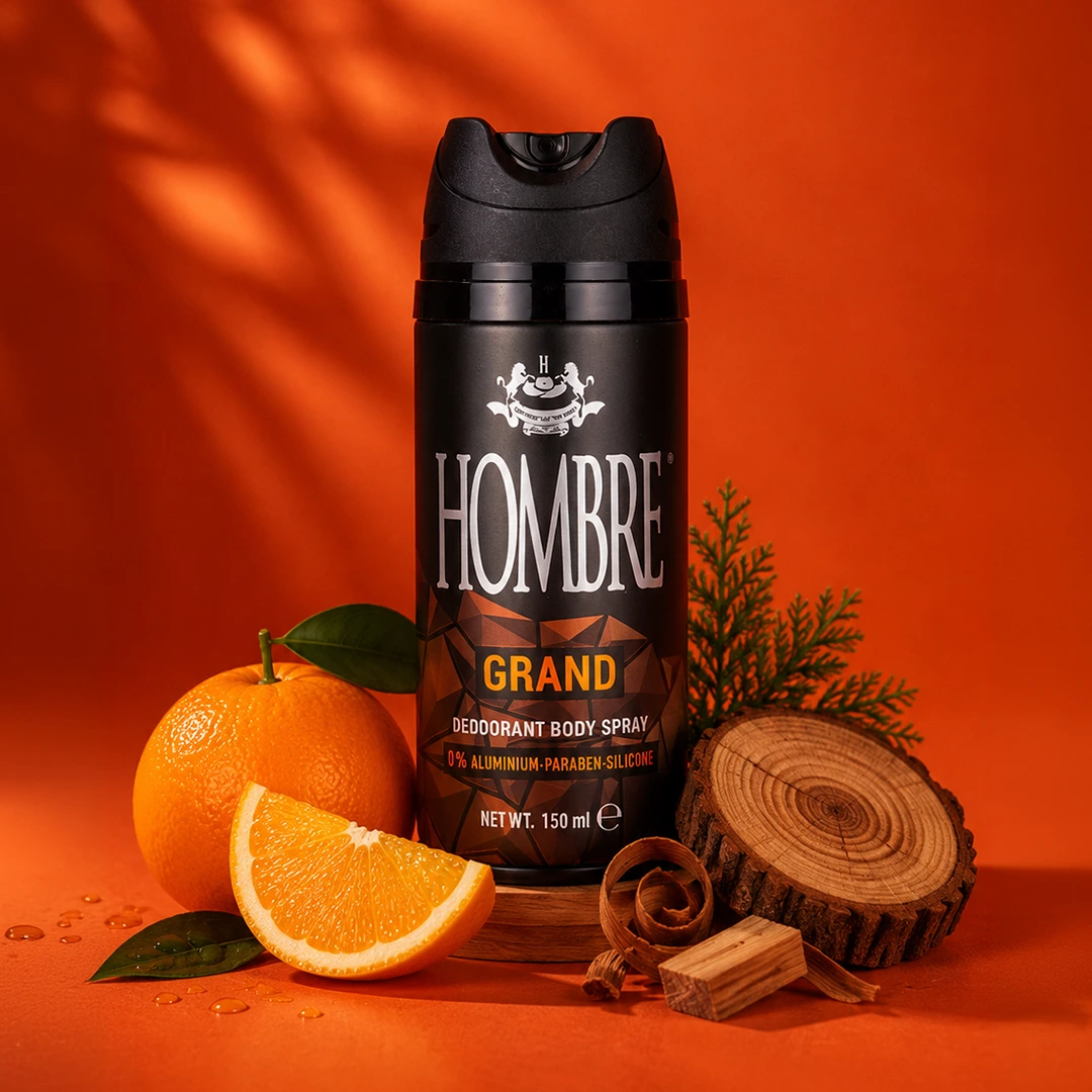 HOMBRE® Grand deodorant spray with orange, cinnamon and spice fragrance notes — ingredient flat lay