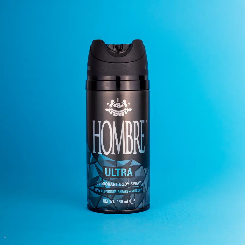 HOMBRE® Ultra deodorant body spray for men on blue background — long-lasting aquatic freshness
