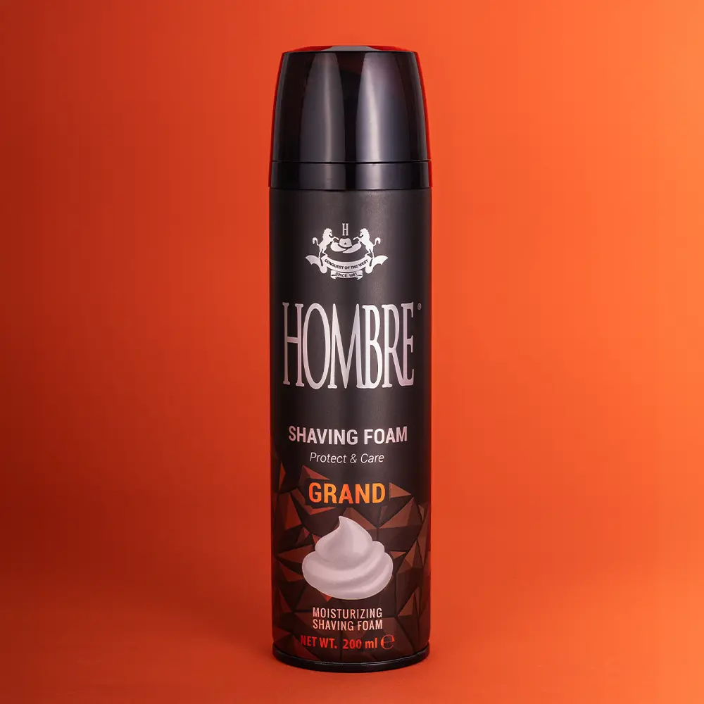 HOMBRE® Grand shaving foam for men on orange background — citrus comfort elevated performance