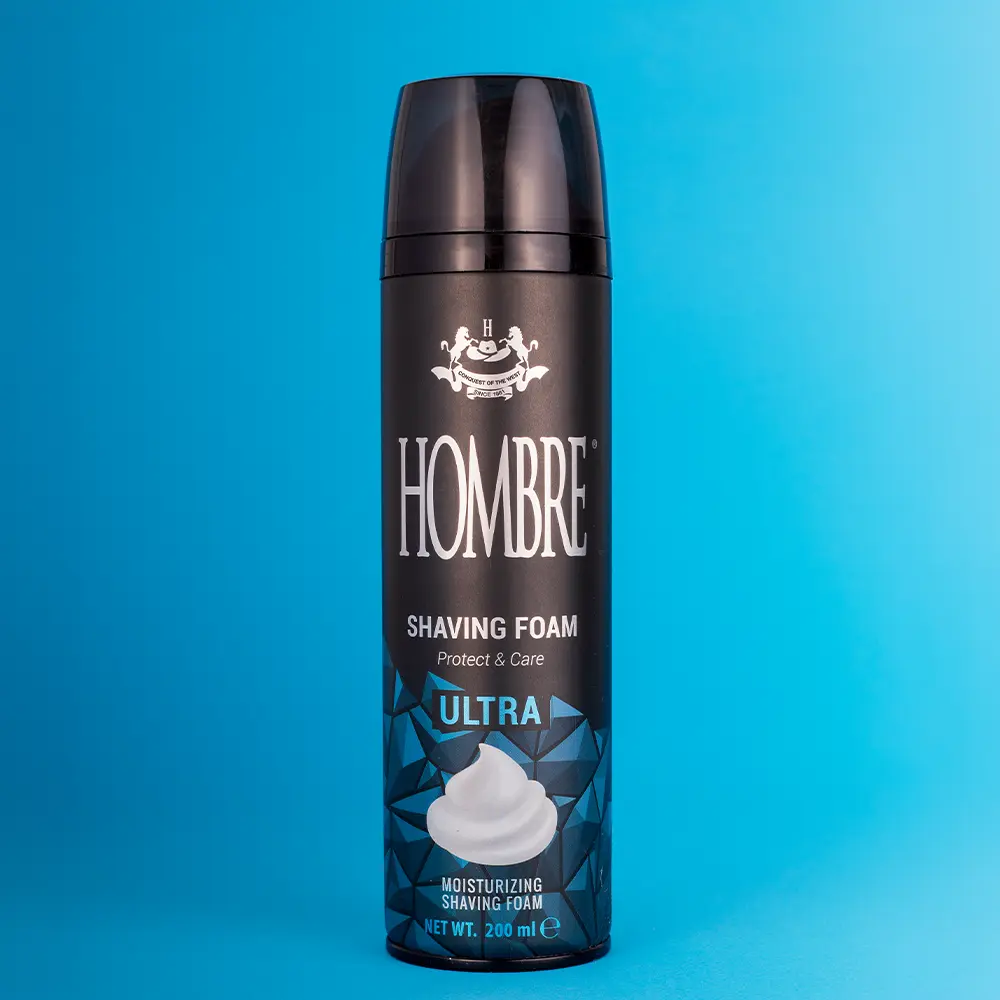 HOMBRE® Ultra shaving foam for men on blue background — woody aquatic scent