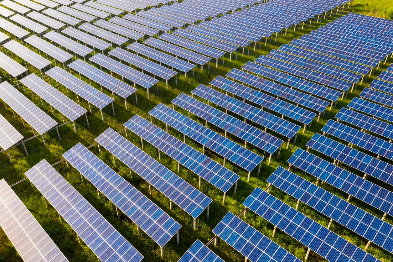 Community solar panel array in an open field