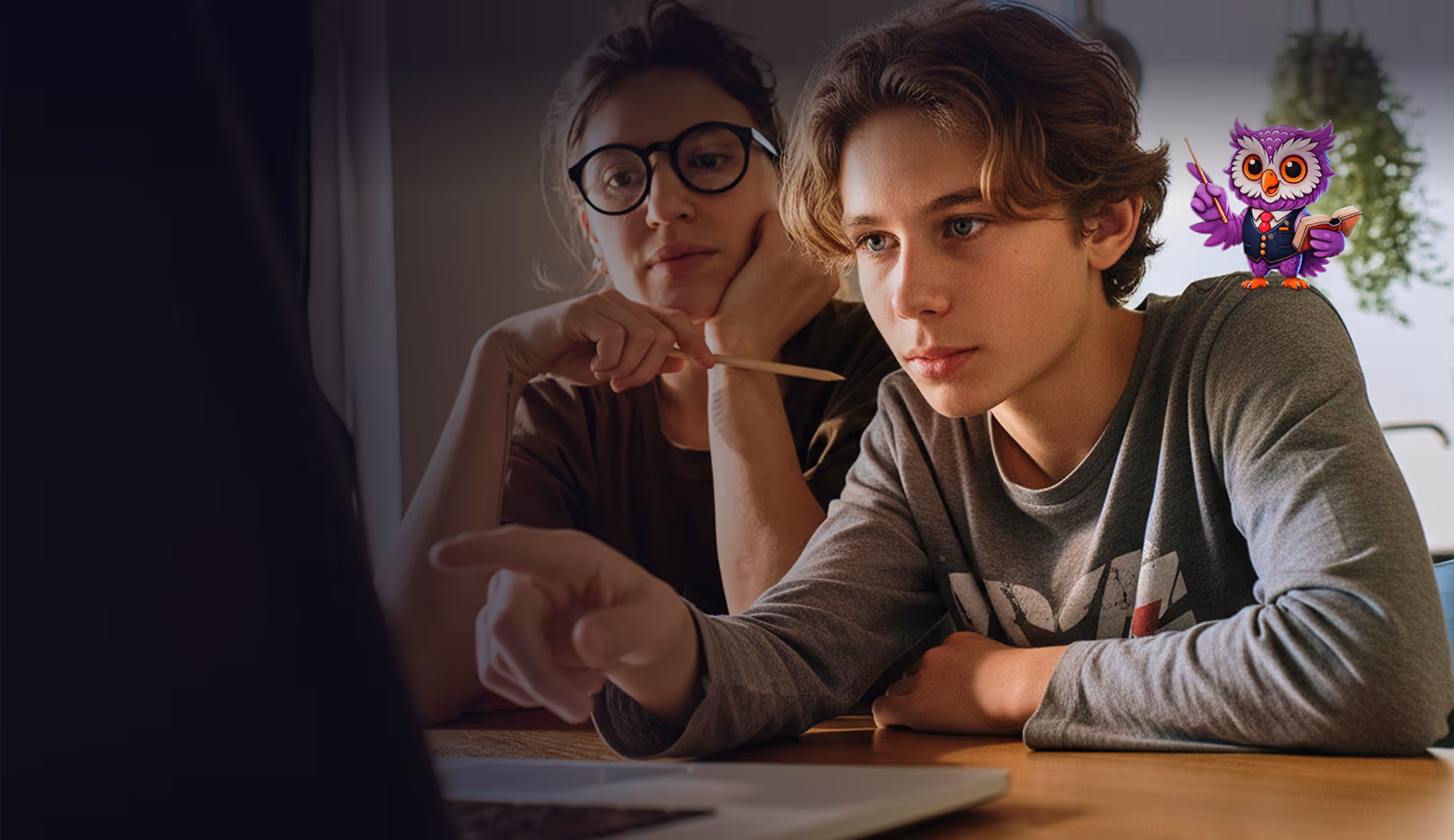 Teen boy pointing at a laptop screen with a woman in glasses watching attentively and a cartoon purple owl holding a book and pointer on his shoulder.