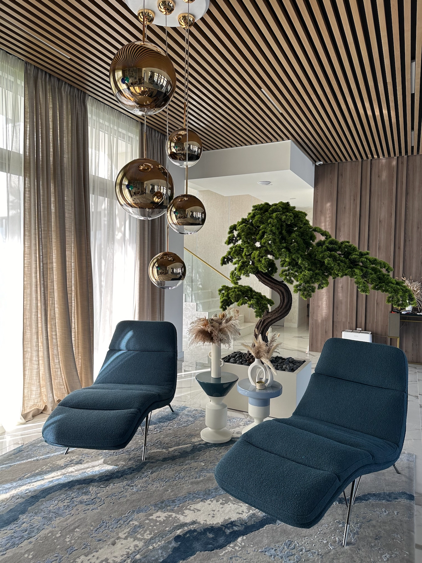 Living room renovation with large-format tile feature wall and luxury interior finishes