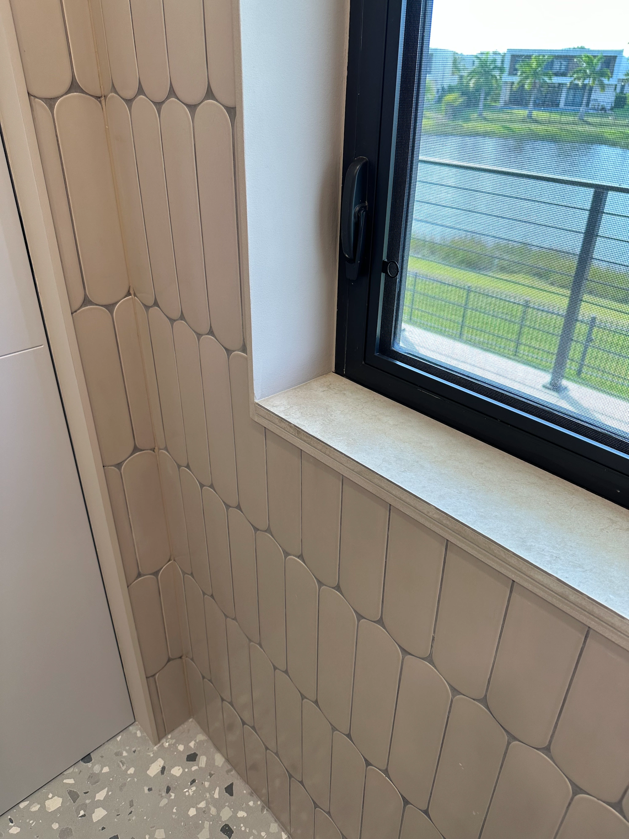 Hand-installed subway tile with even grout lines in Miami bathroom