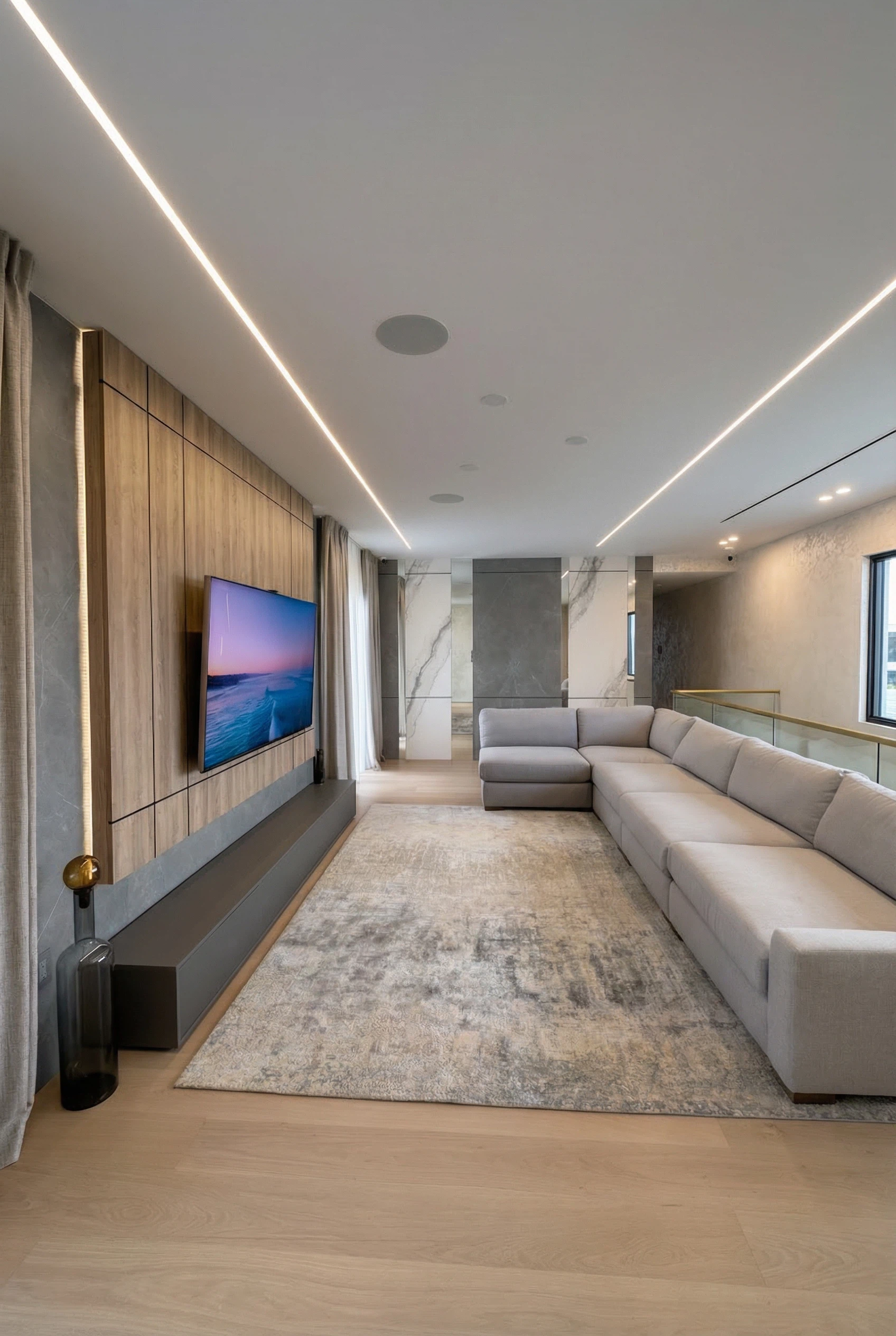 Modern living room with custom wall panels and integrated lighting