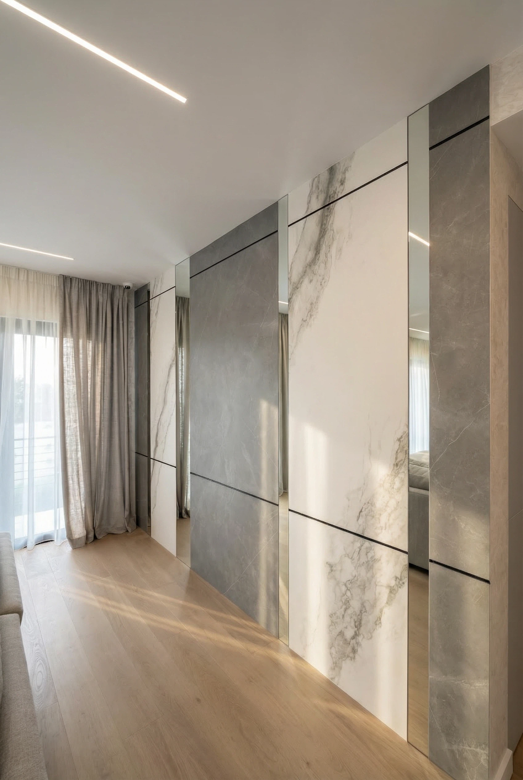 Large-format porcelain slab wall installation with precision panel alignment in Miami interior