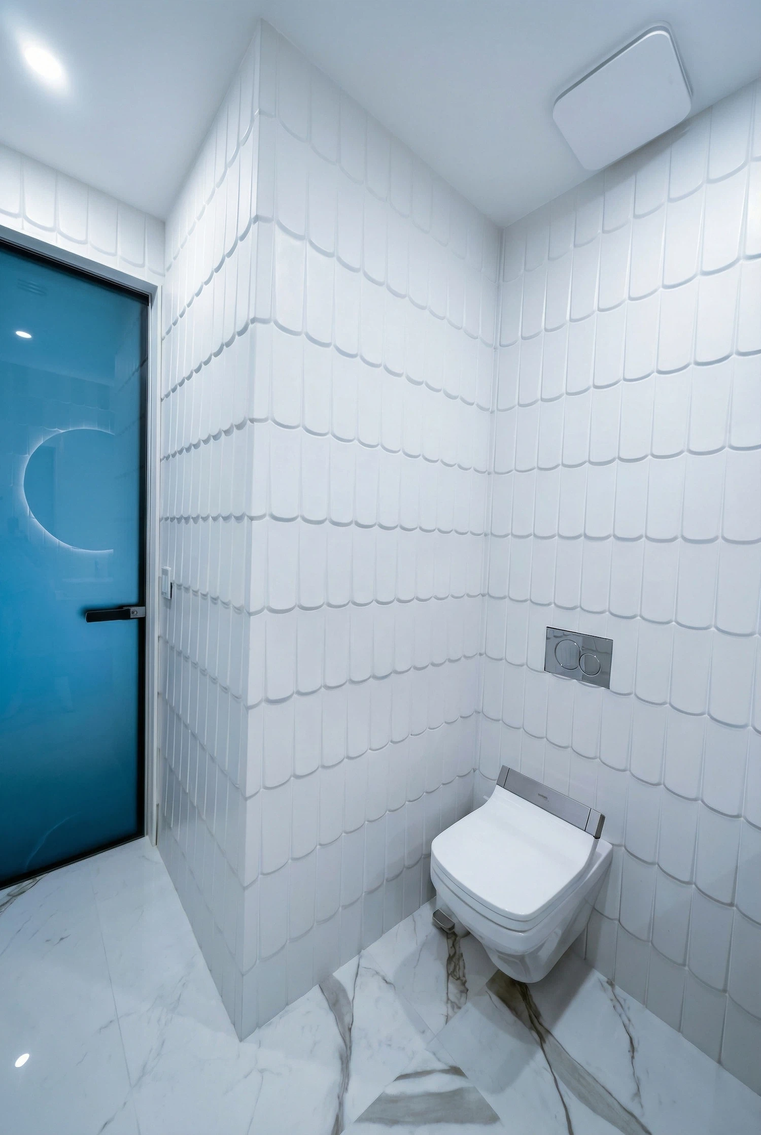 Interior wall tile installation by Miami tile contractor showing custom pastel accent tiles around vanity area