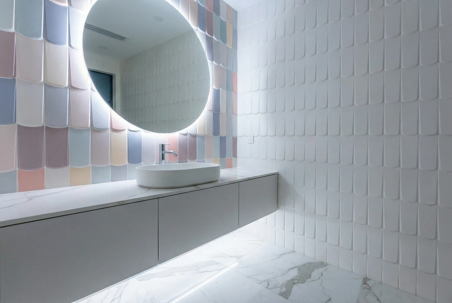 Modern bathroom tile installation in Miami featuring pastel decorative accent wall tiles, floating vanity, and LED backlit mirror