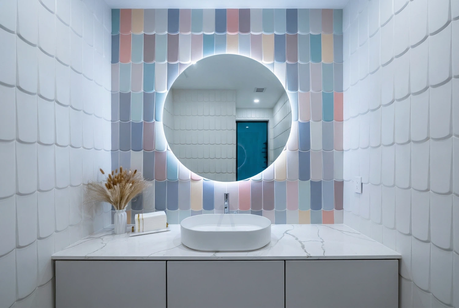 Contemporary bathroom with decorative tiled accent wall and illuminated round mirror