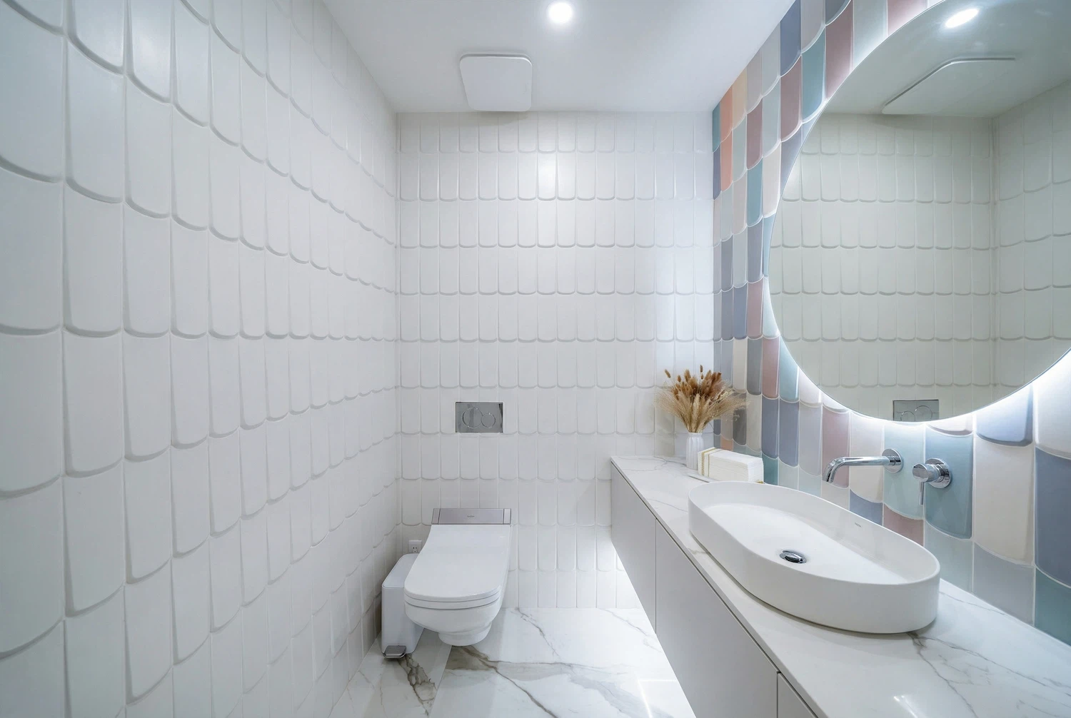 Interior wall tile installation by Miami tile contractor ArtivaTile  showing custom pastel accent tiles around vanity area