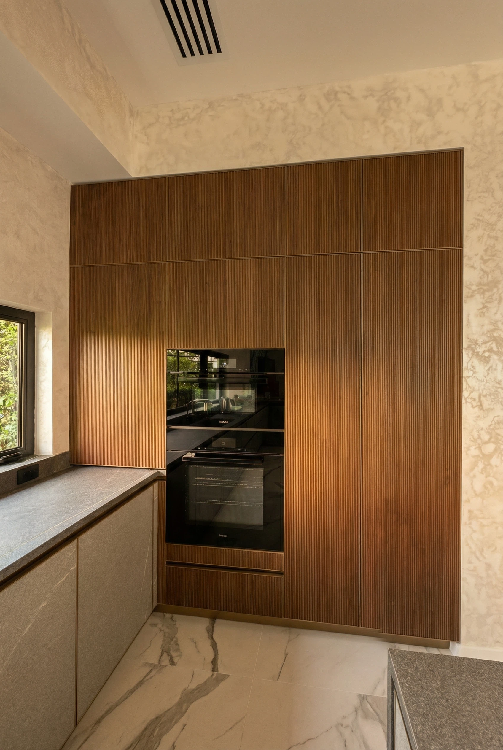 Custom porcelain slab kitchen remodel with precision fabrication, countertop installation, and integrated sink.