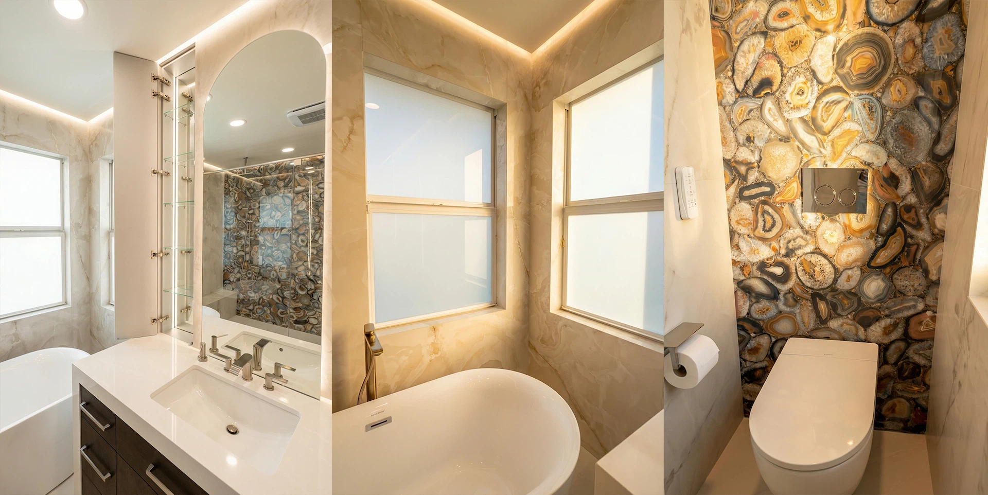 Walk-in shower with marble-look large format tiles and decorative mosaic accent wall