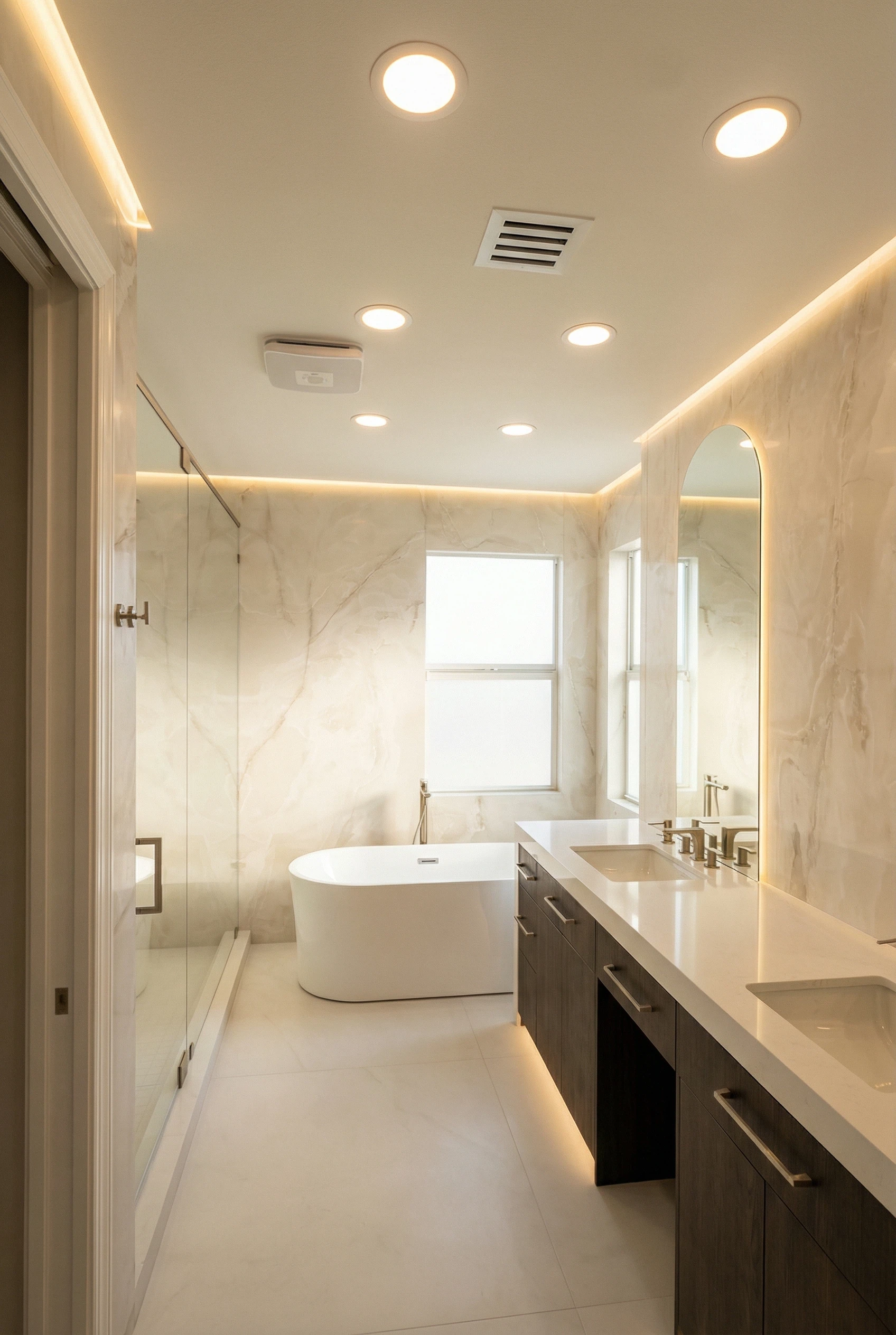 Master bathroom interior with freestanding tub and large format floor tiles