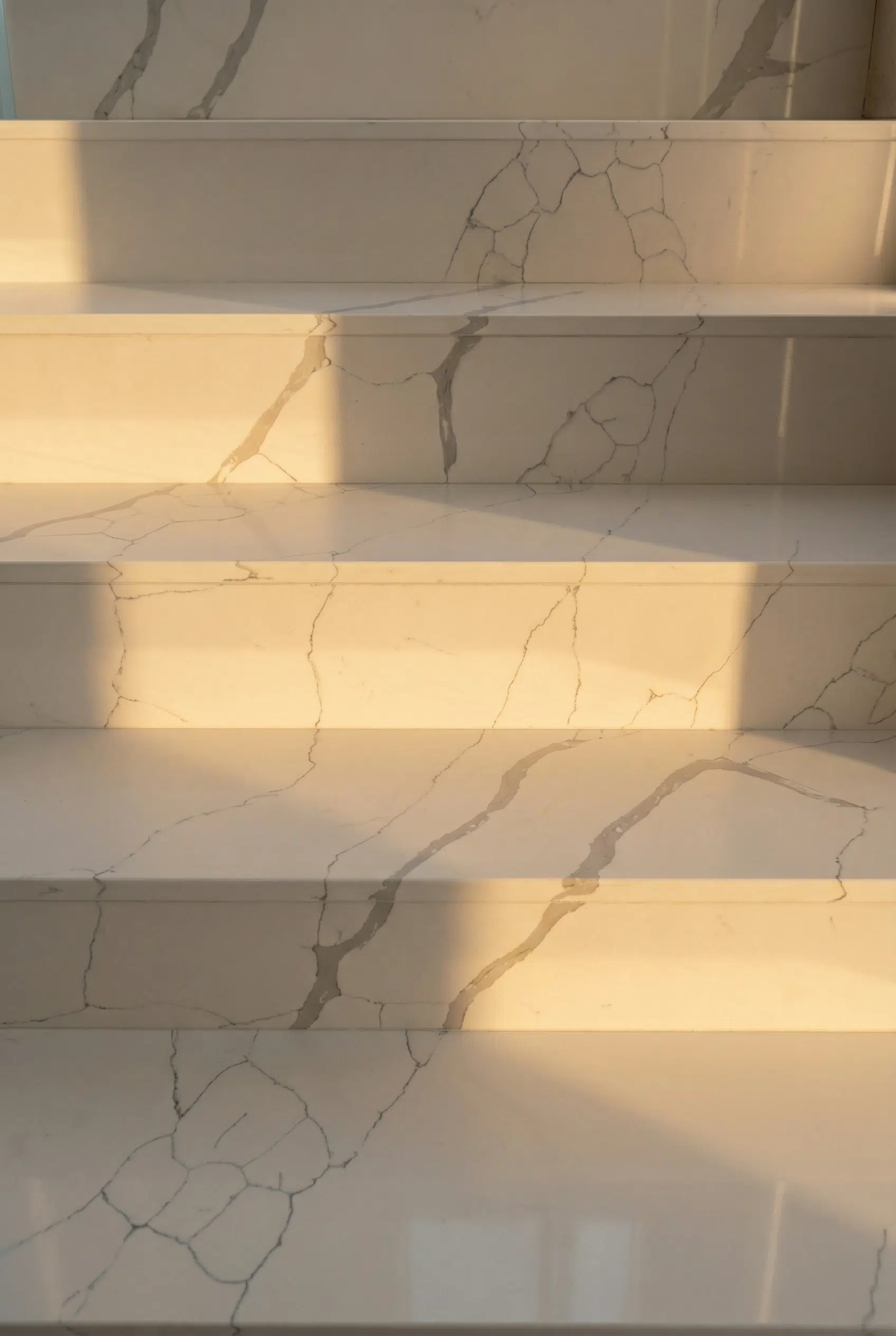 Large-format slabs transform each step into a clean, architectural element