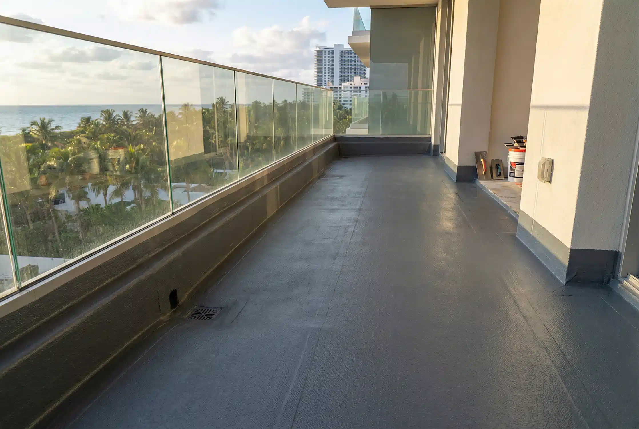 Waterproofed outdoor balcony with drainage and surface preparation before tile installation in Miami