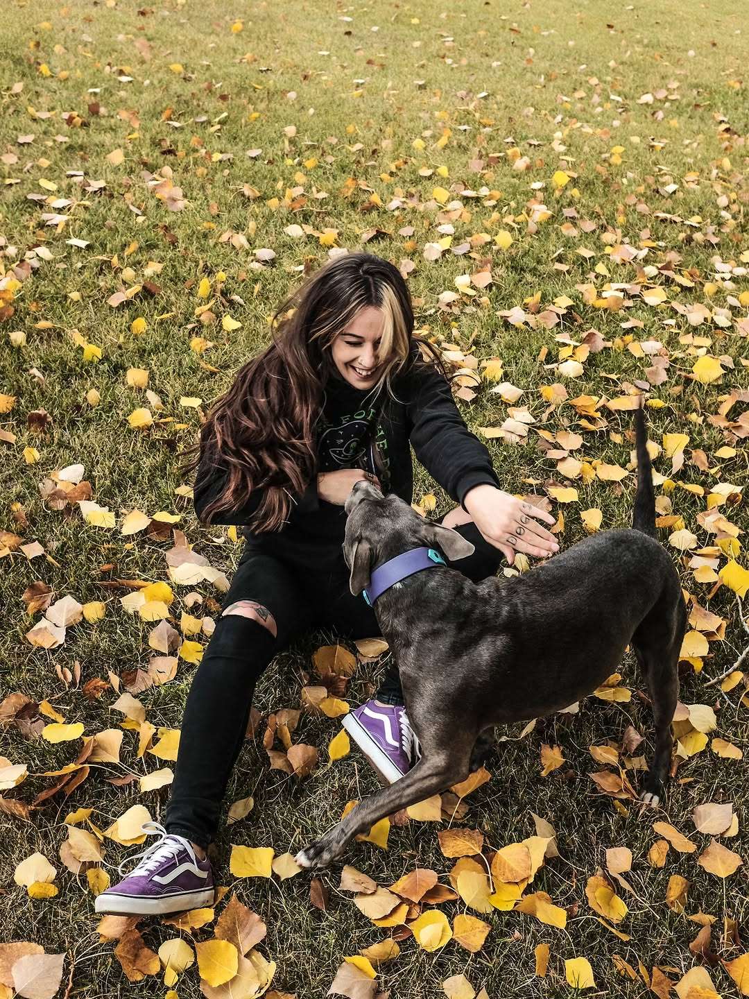 Hannah of 3 of Hounds playing with her dog Trunks