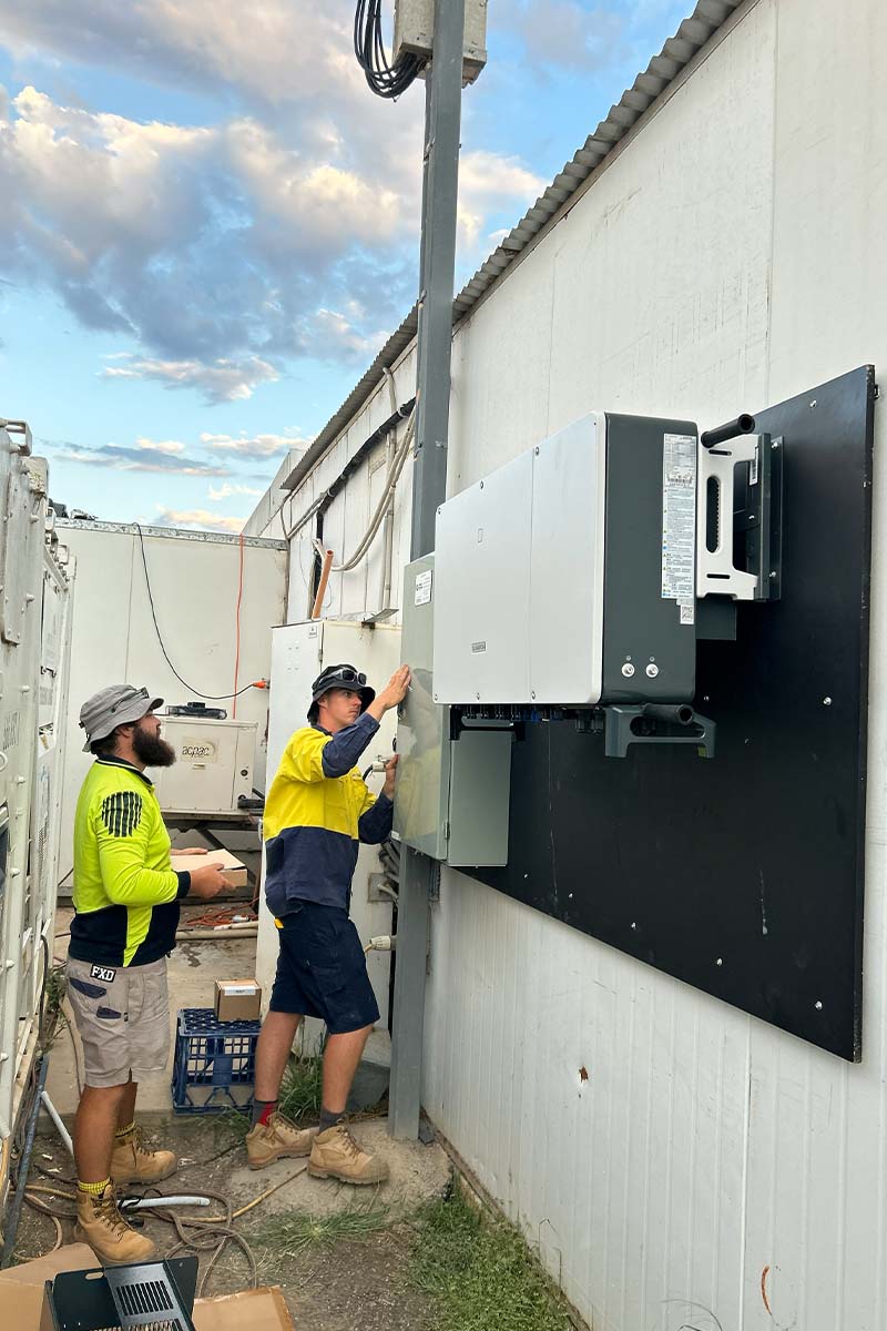 solar electricians working on system