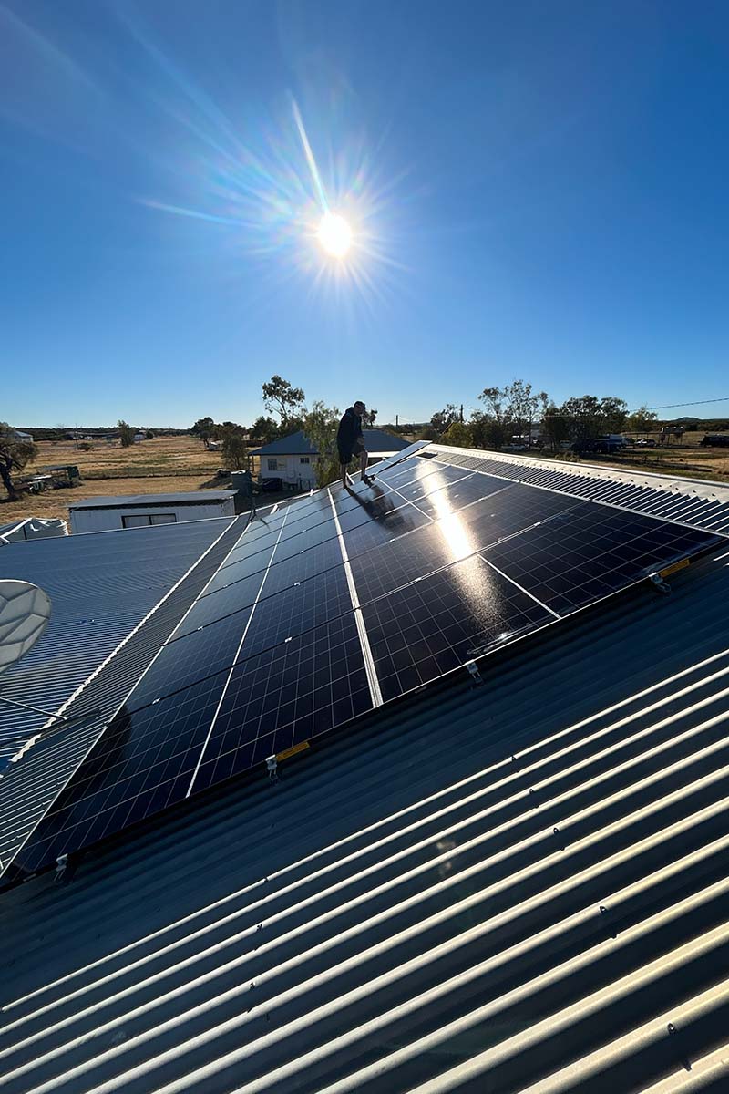 solar installer on roof