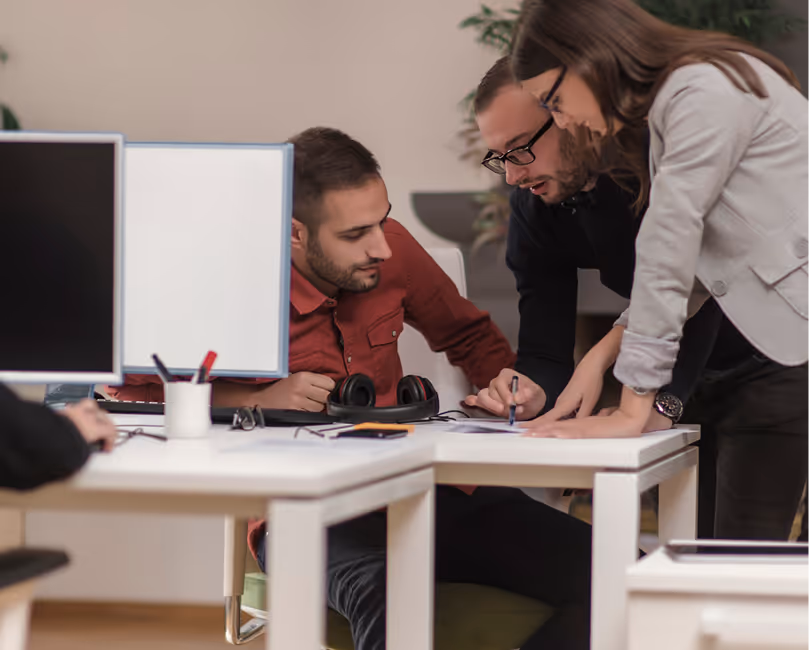 Staff working at their desks inside an office