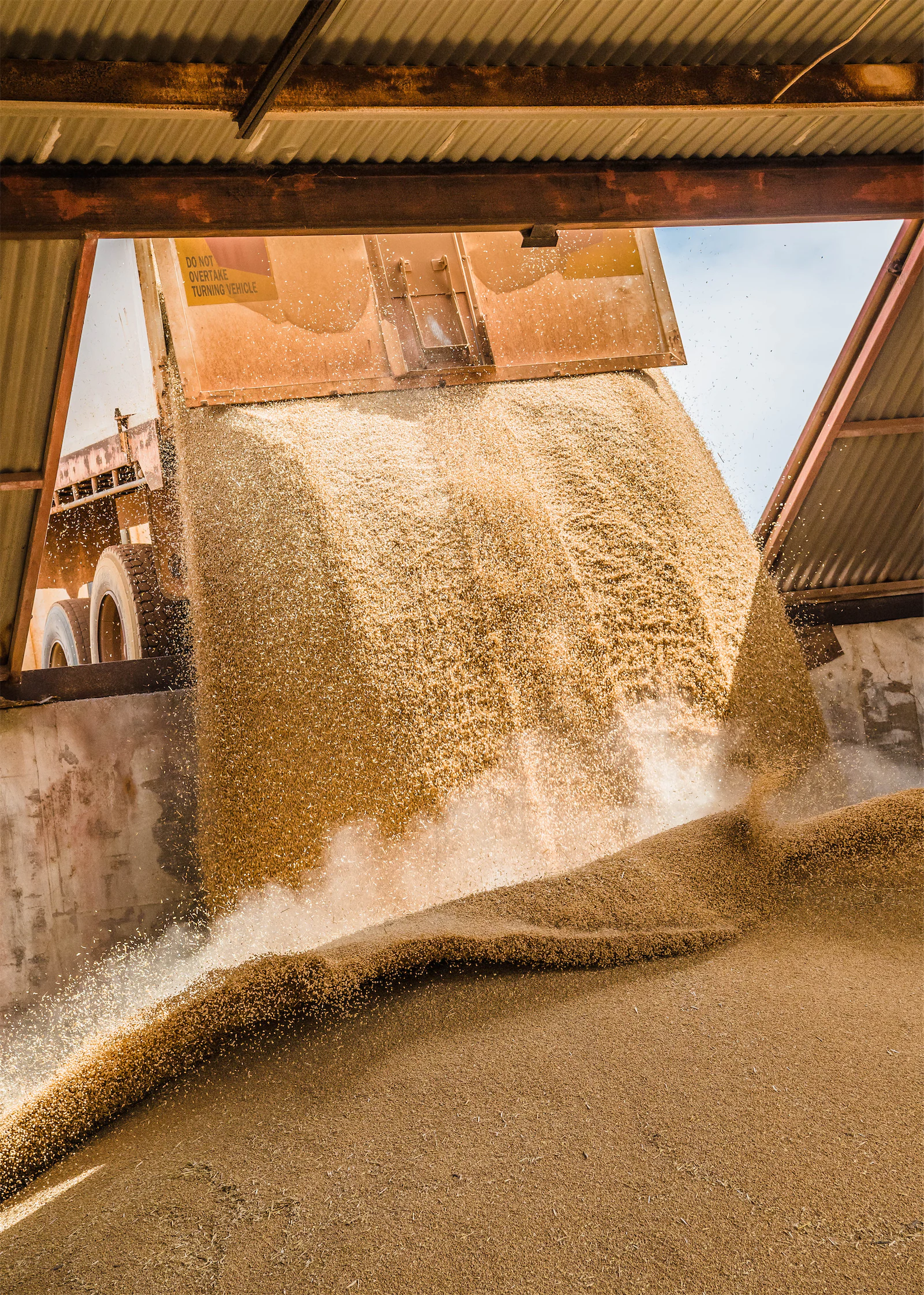 Grain being poured into a bunker at a storage facility in Australia